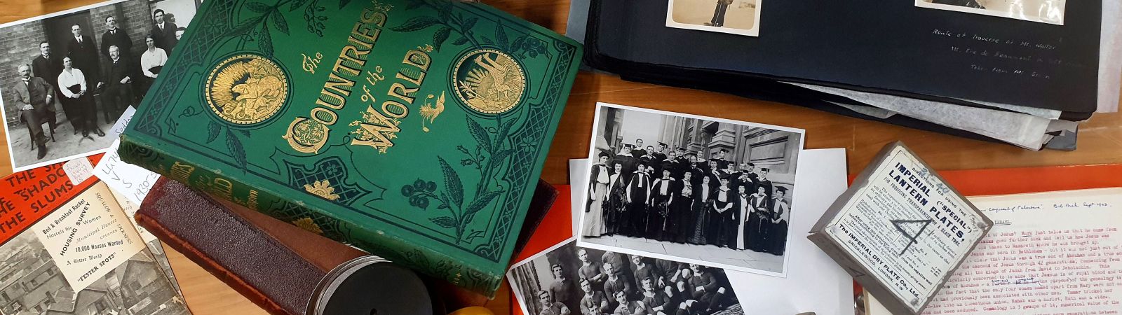 Objects from the J. C. Beaglehole Room scattered on a desk