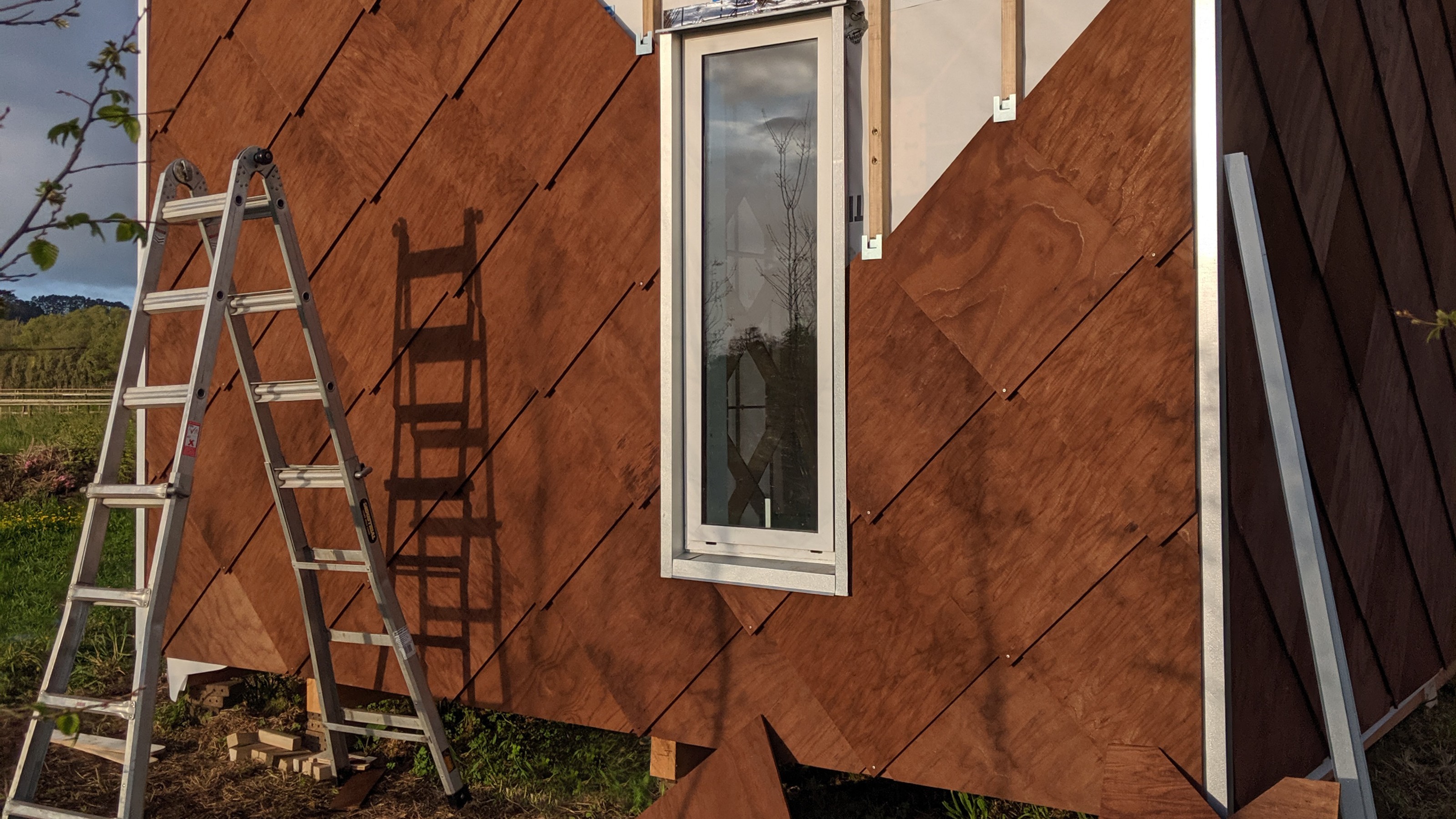 House being cladded with wooden tiles