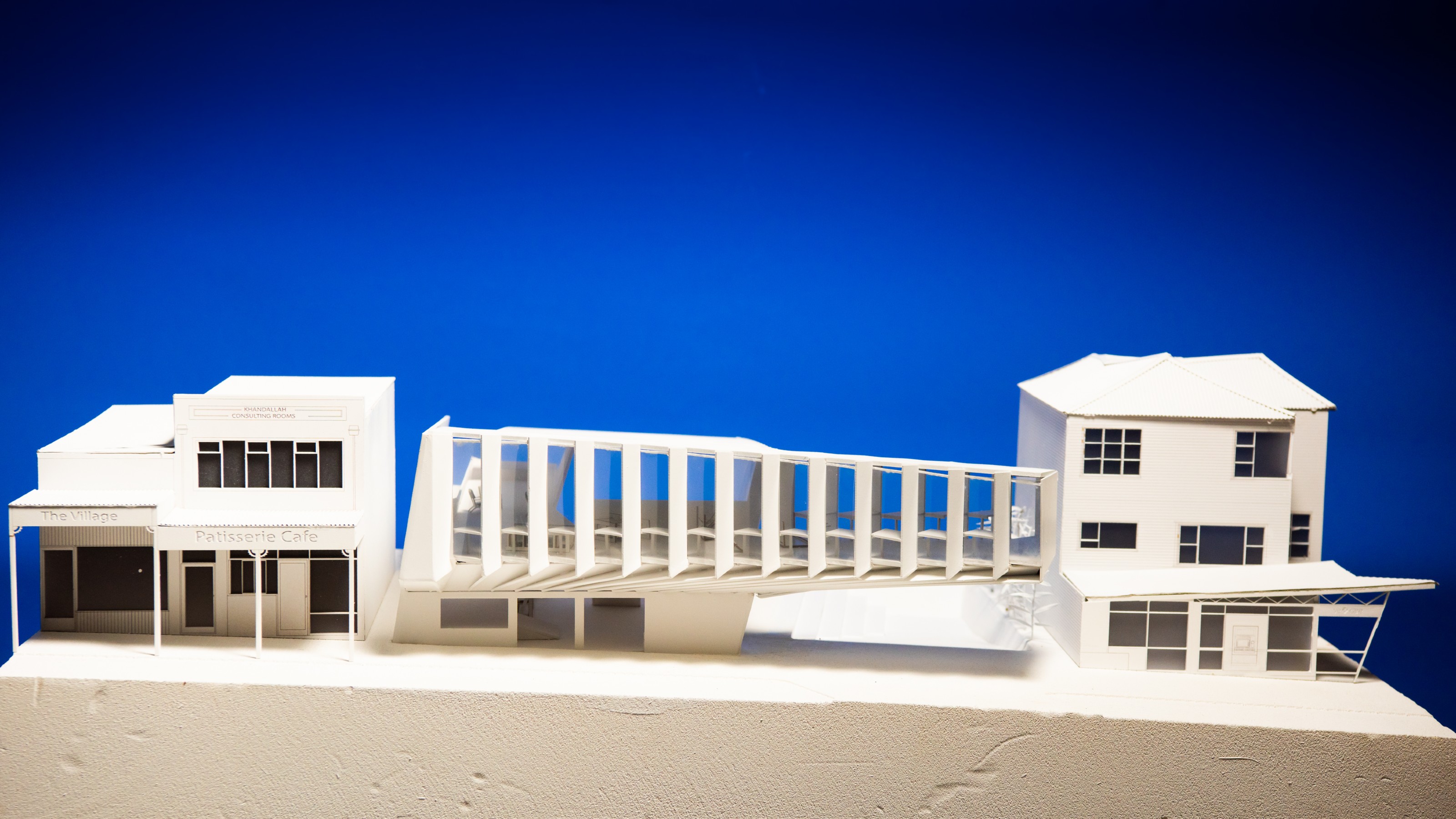 Architectural model of Khandallah library in front of blue background by Harry Davis