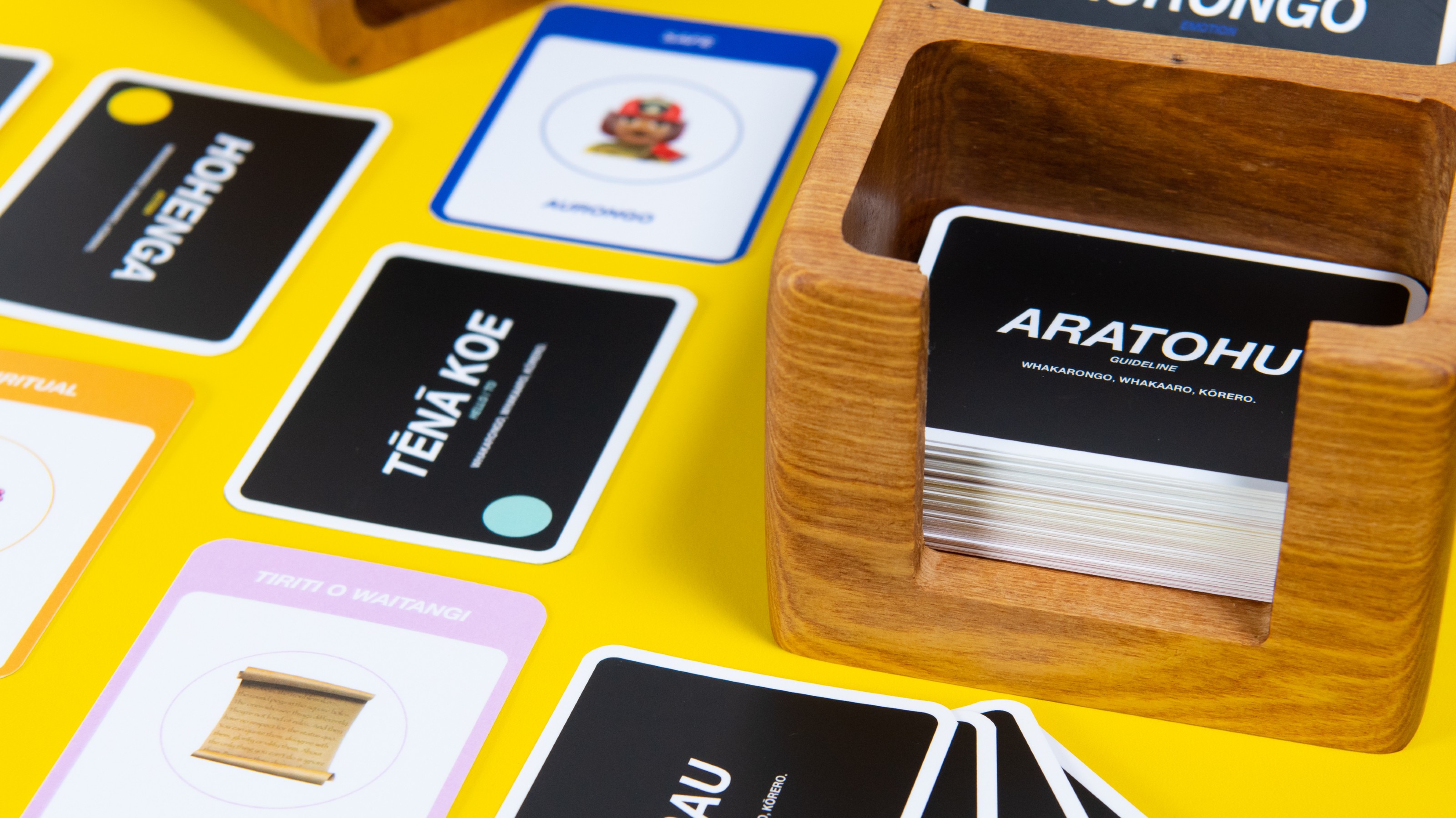 card game with wooden box on yellow background