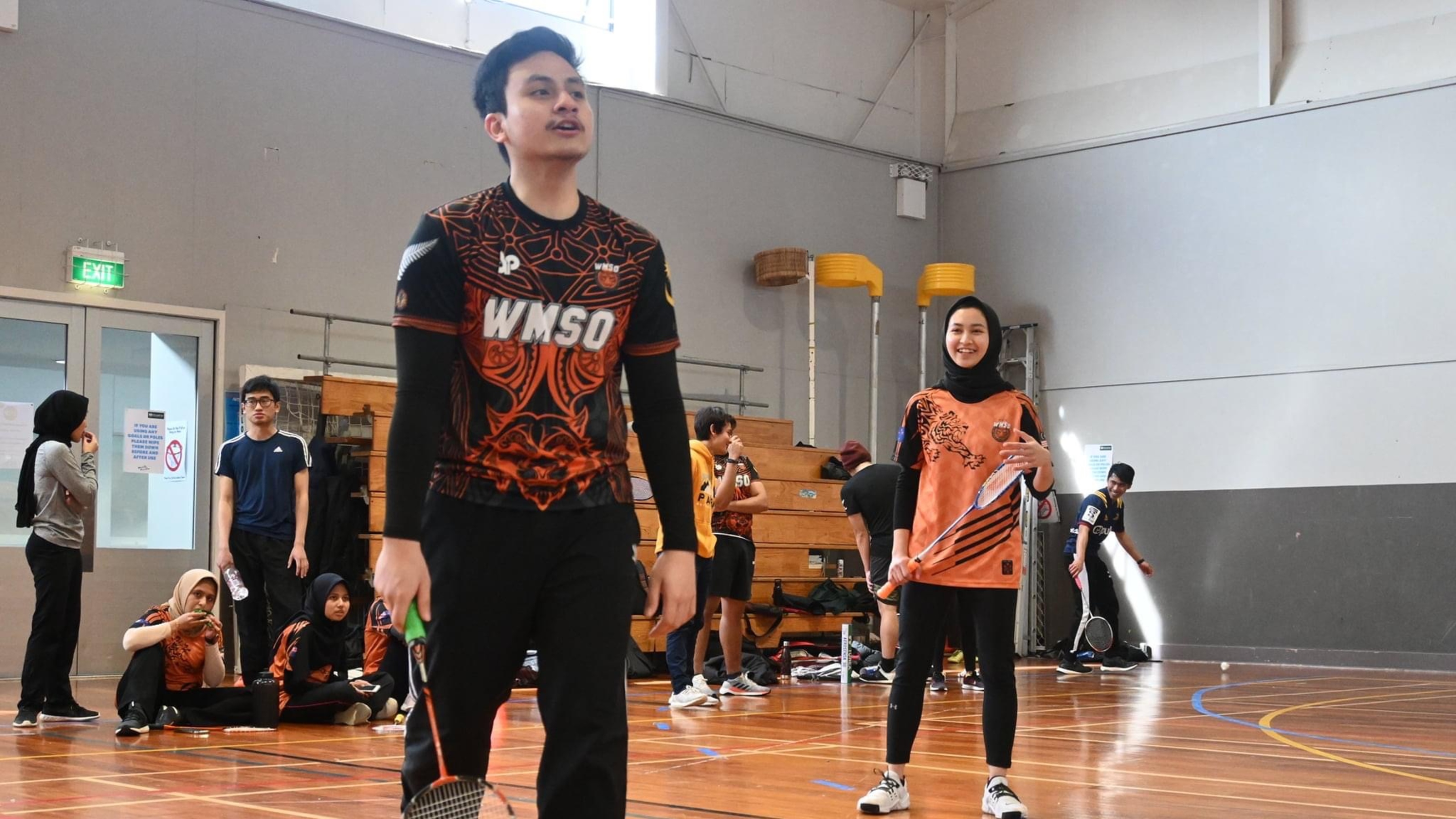 Student members playing badminton.