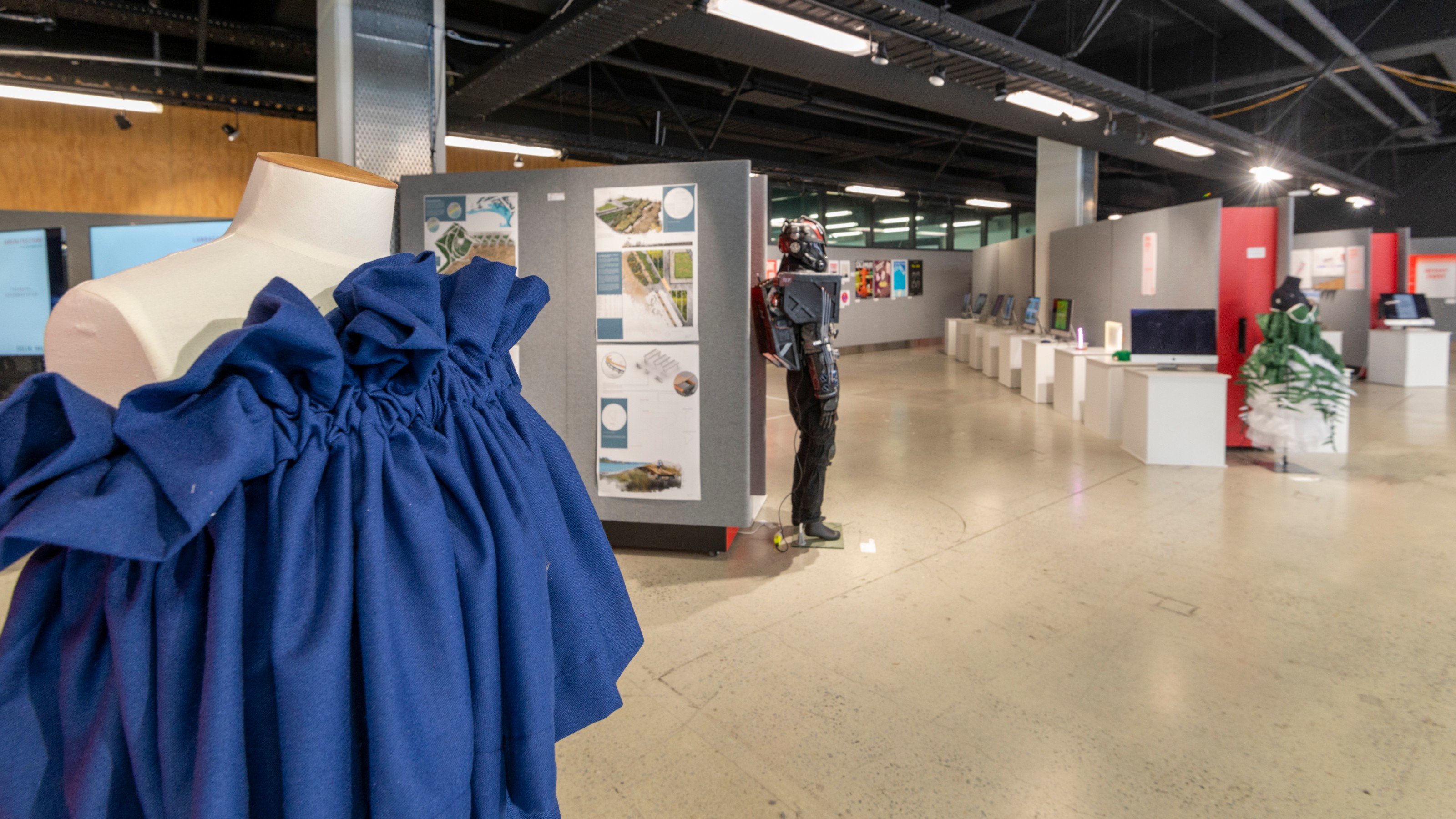 Blue dress designed by fashion design technology student and other objects on display at the Wellington Faculty of Architecture and Design Innovation End of Year Exhibition 2019