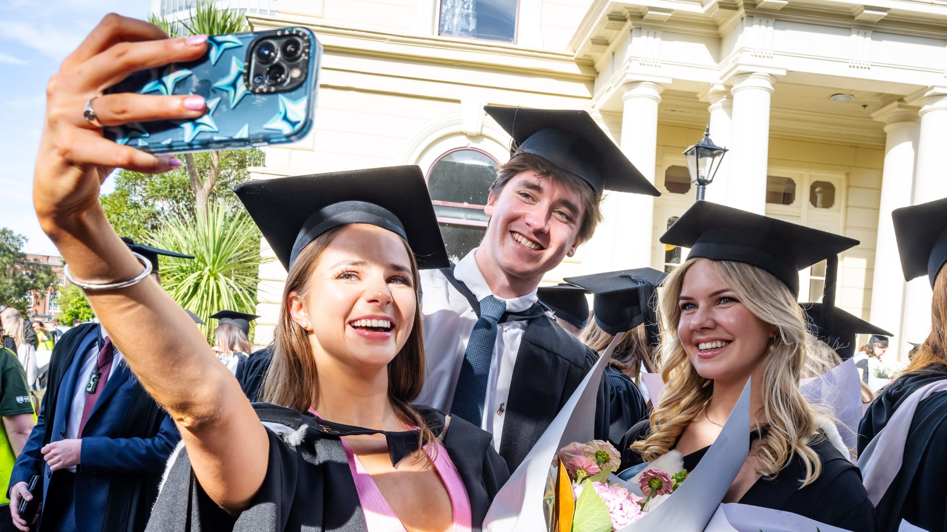 Graduates taking a selfie