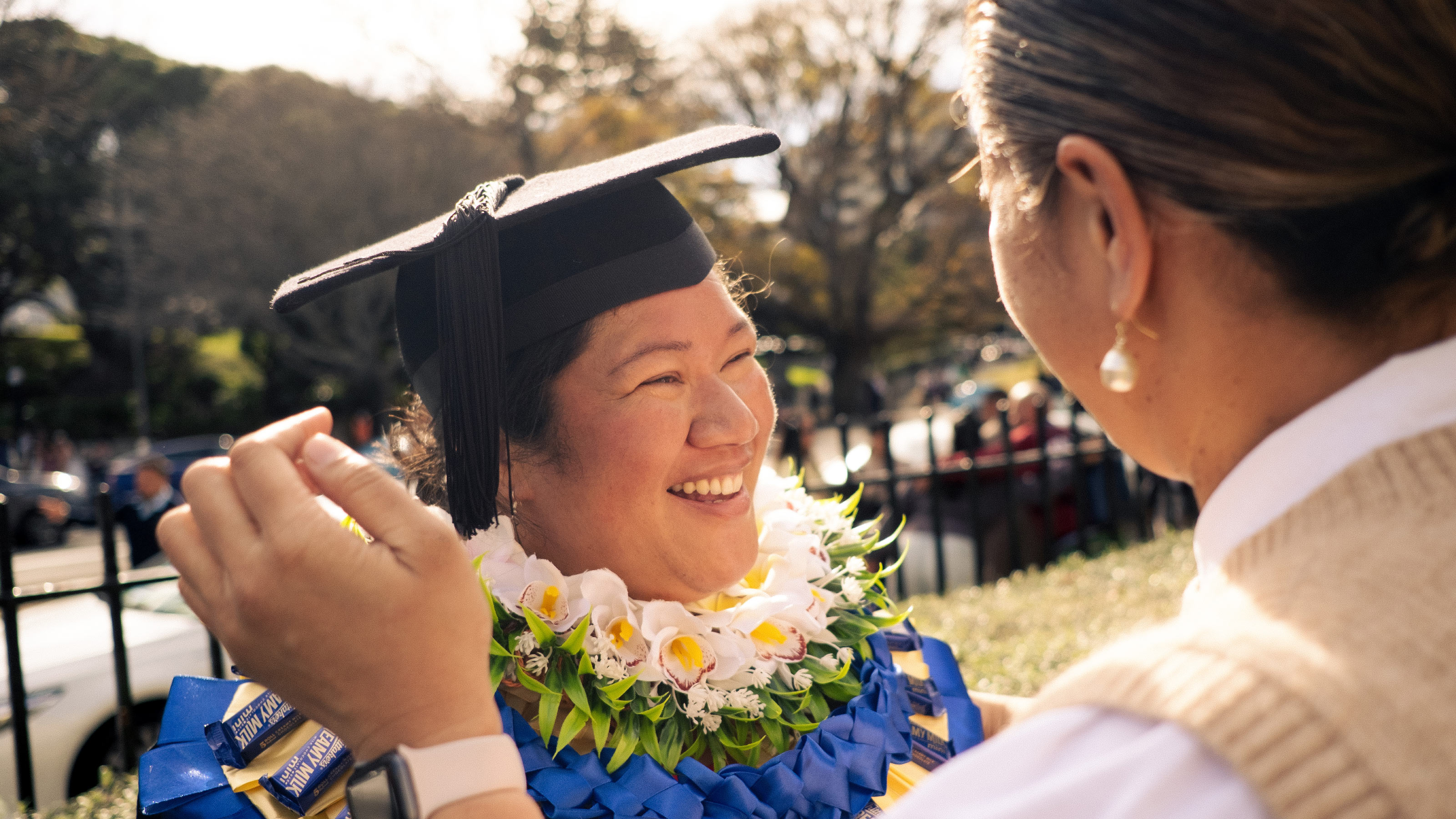 Postgraduate student smiling on Graduation day
