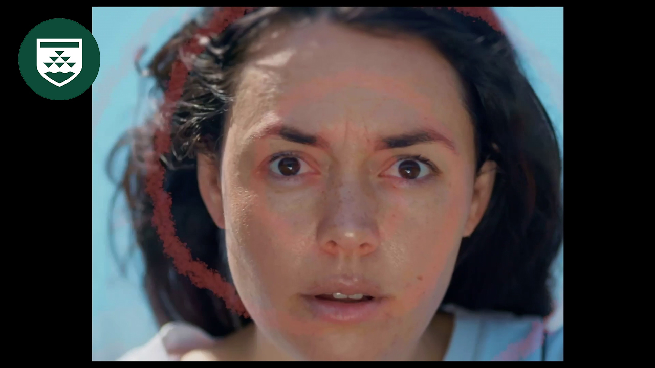 A face with a sort of hypnotized look and an overlaid transparent hypnotic spiral.