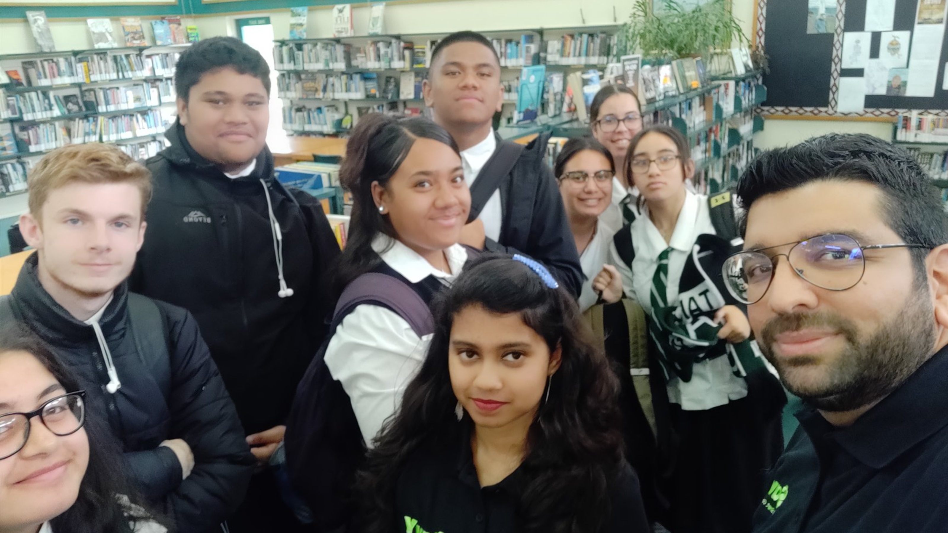 Students selfie in school library at SavY event.
