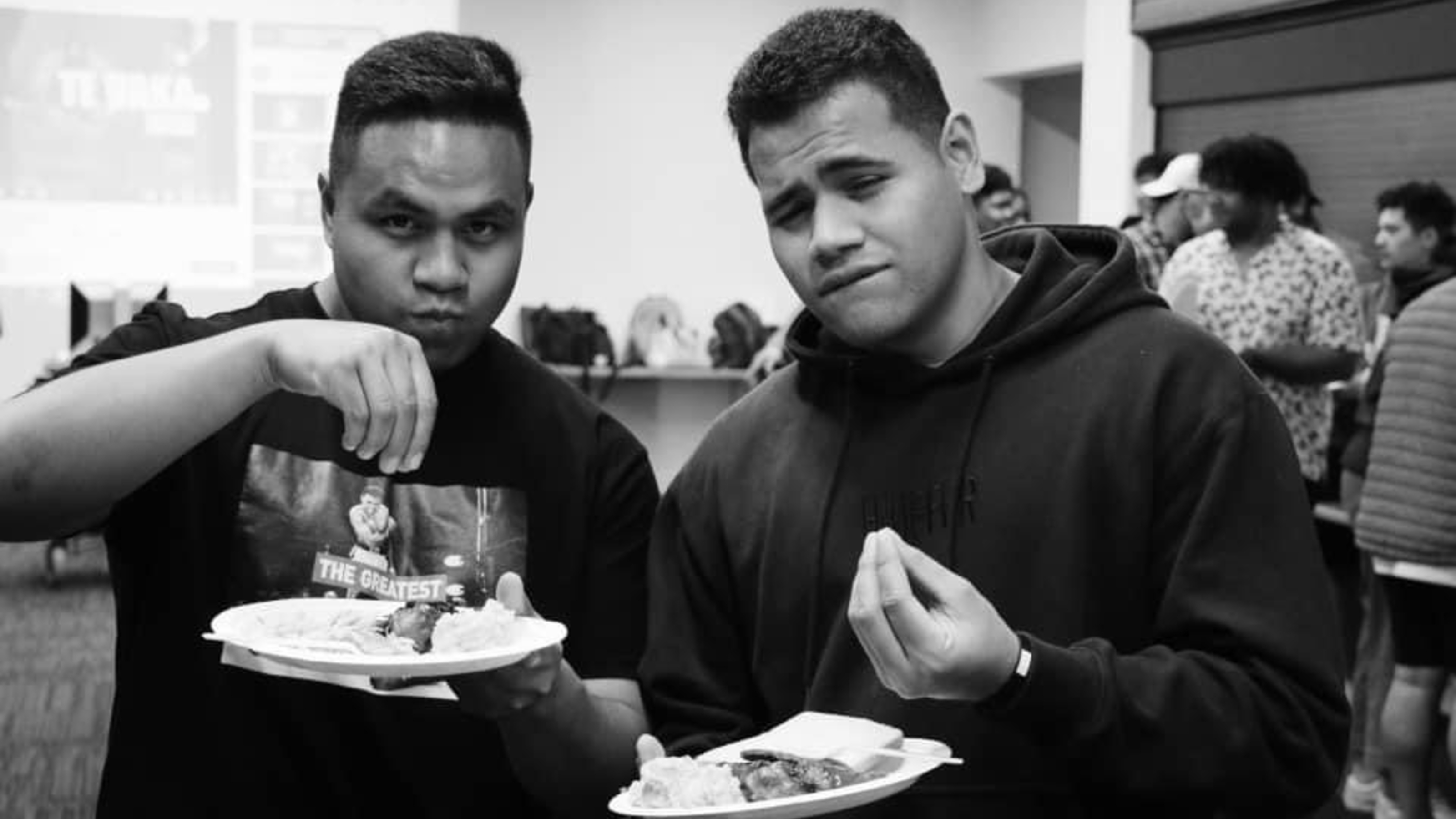 Two students appreciating food.