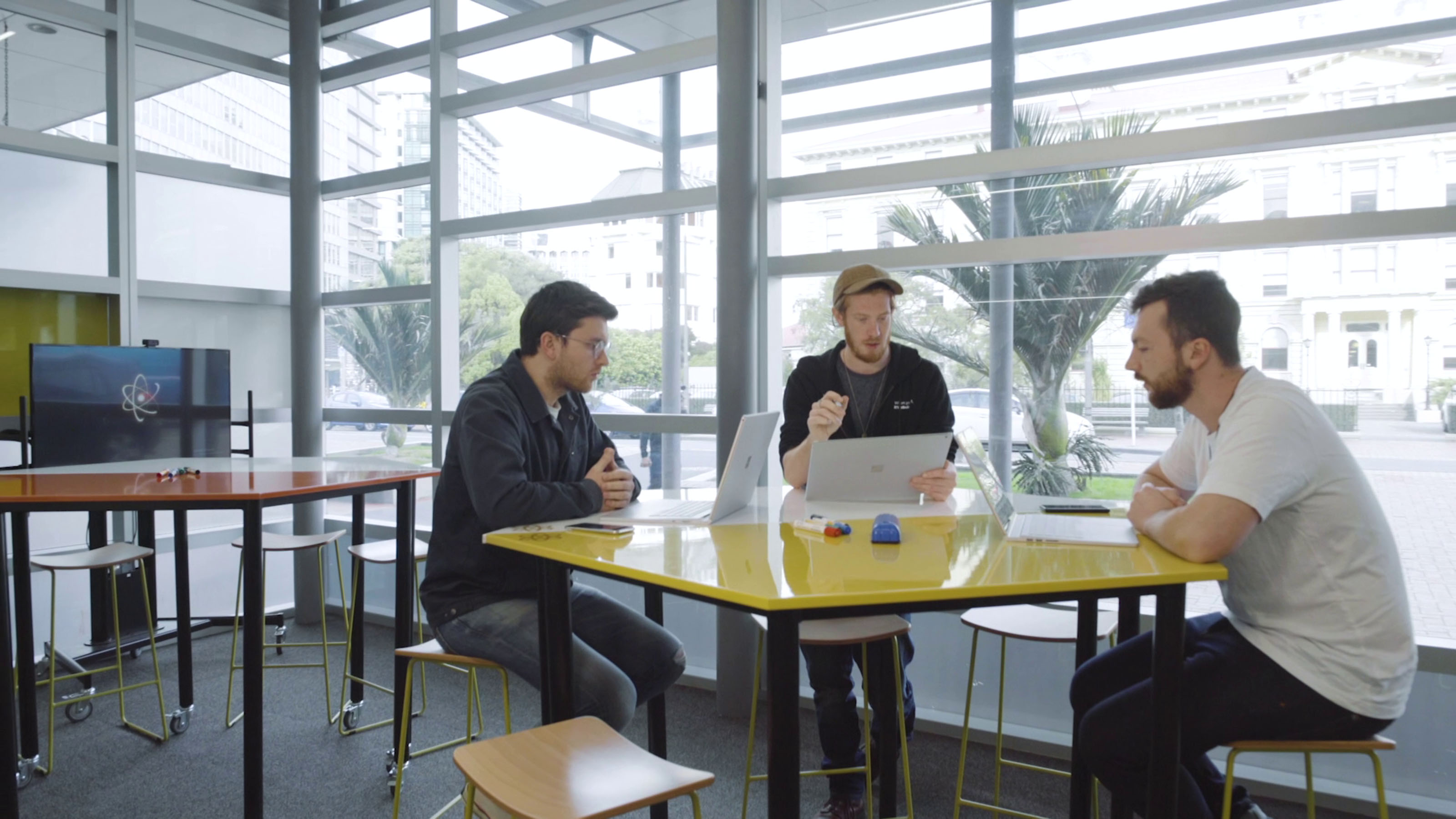 Jarrod Mosen, Ciaran Jack, and Michael Watson from StudySpy working in The Atom Innovation space.