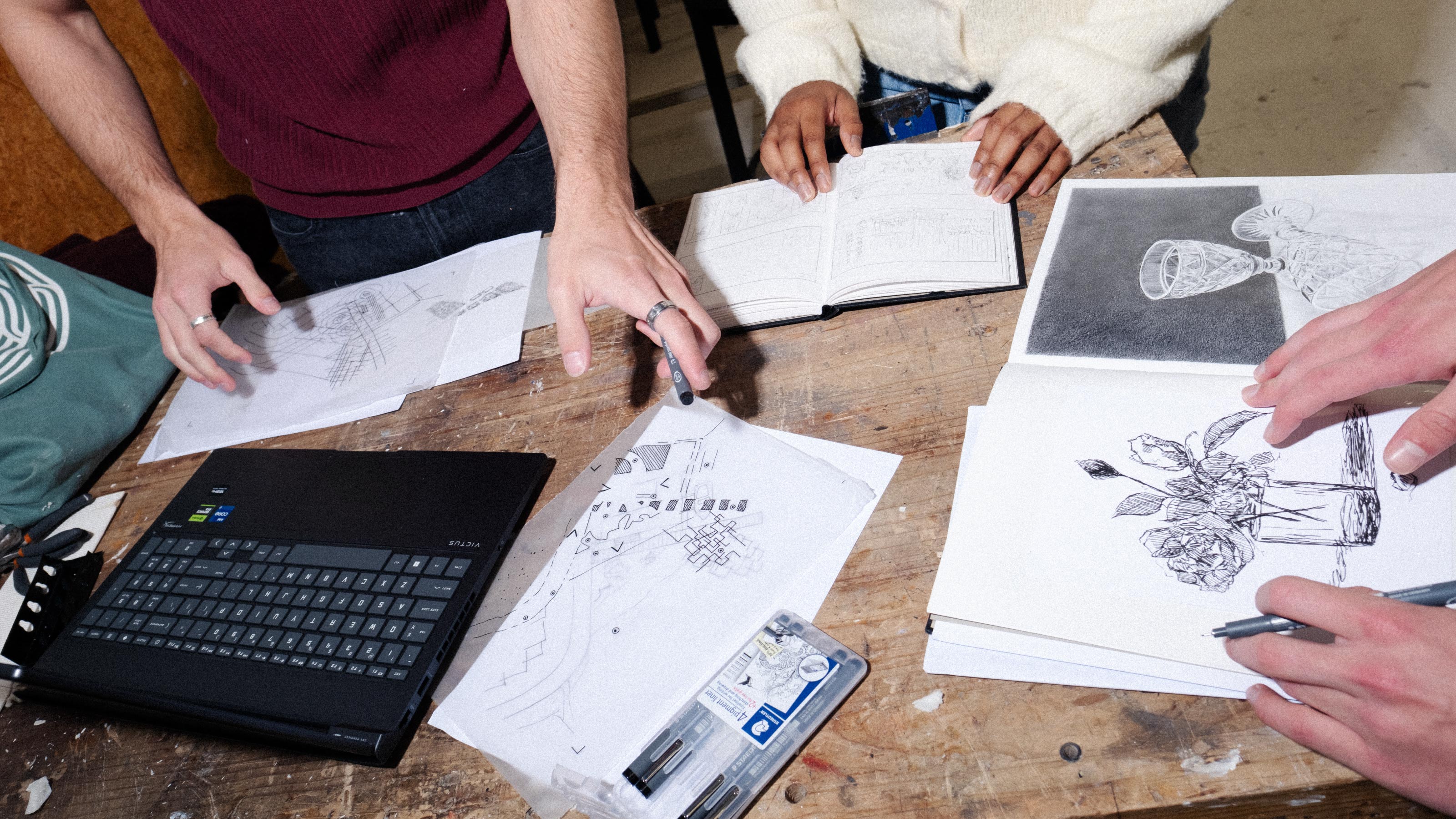 Students drawings on a table