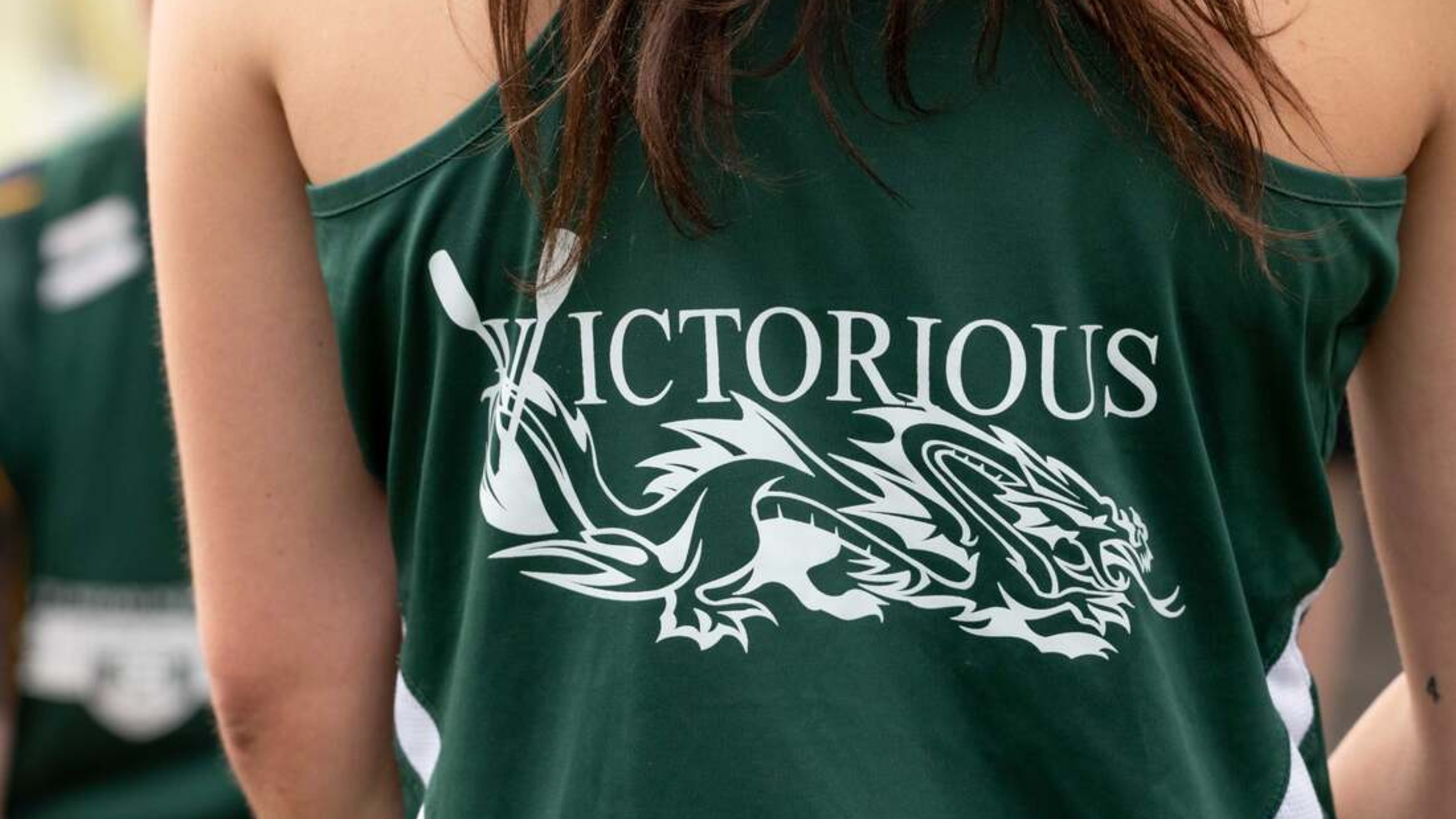 Close up of the Victorious team jerseys, showing a dragon drawing.