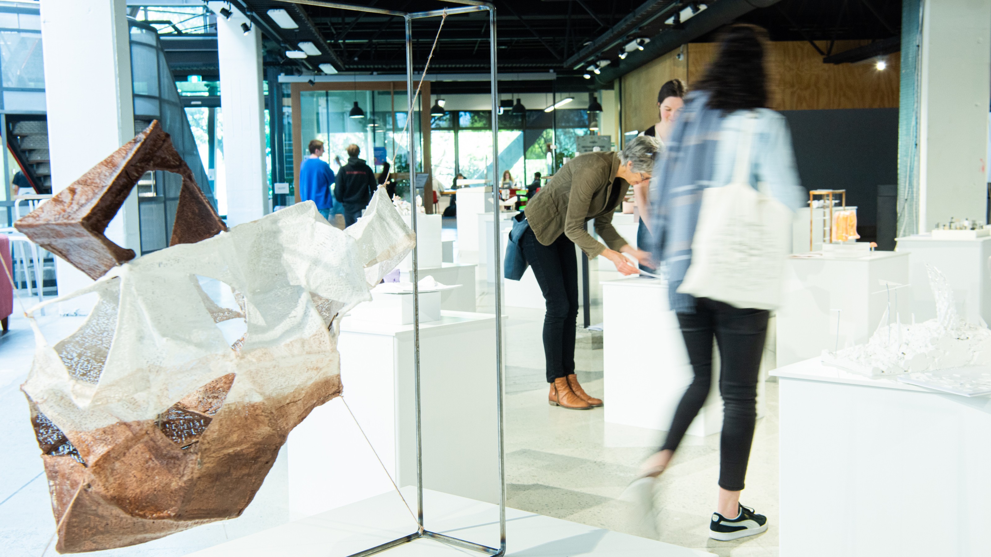 Visitors enjoying the Collective properties exhibition by SARC 261 elective students