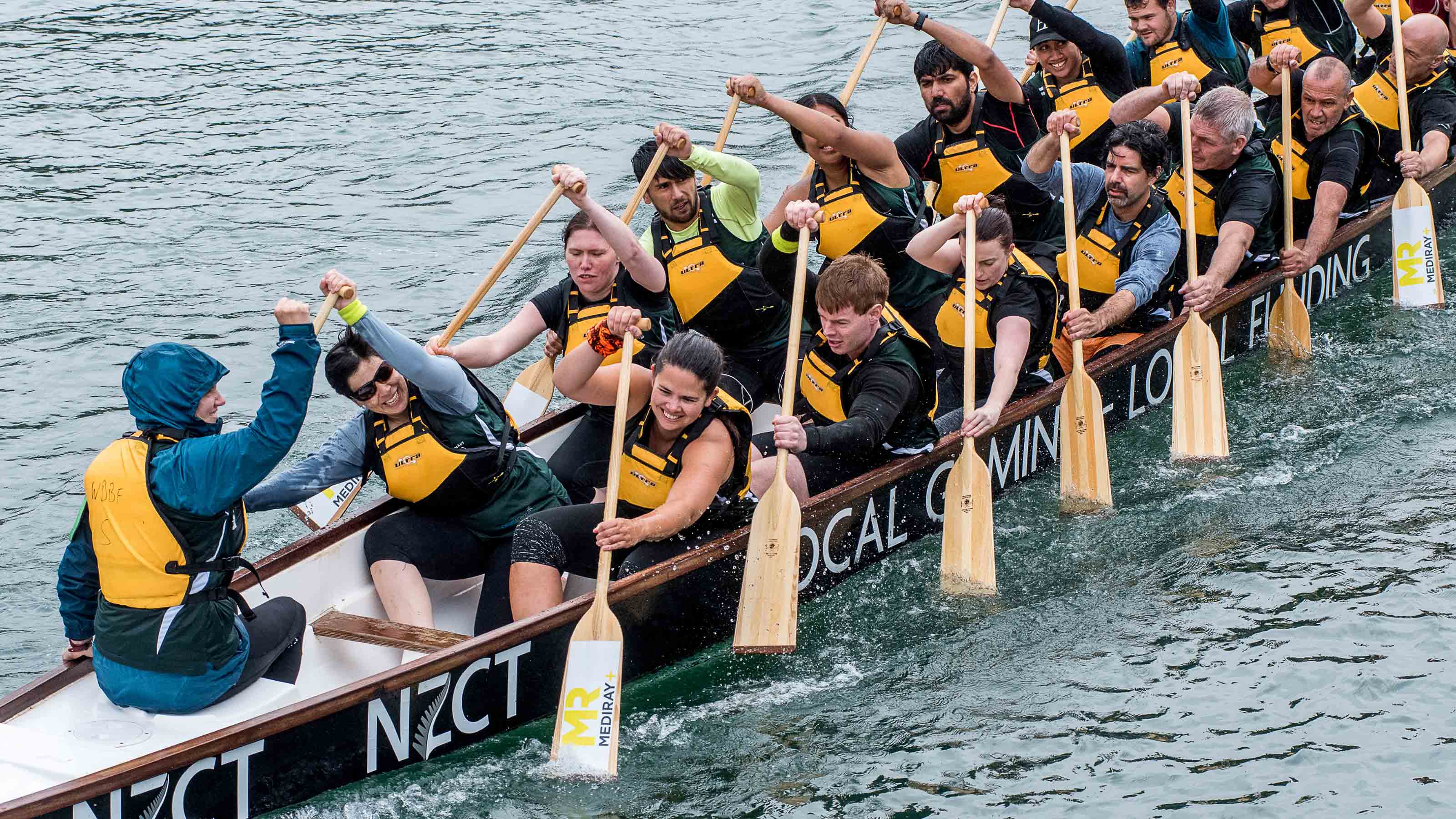 Dragon boat team dragon boating in the ocean