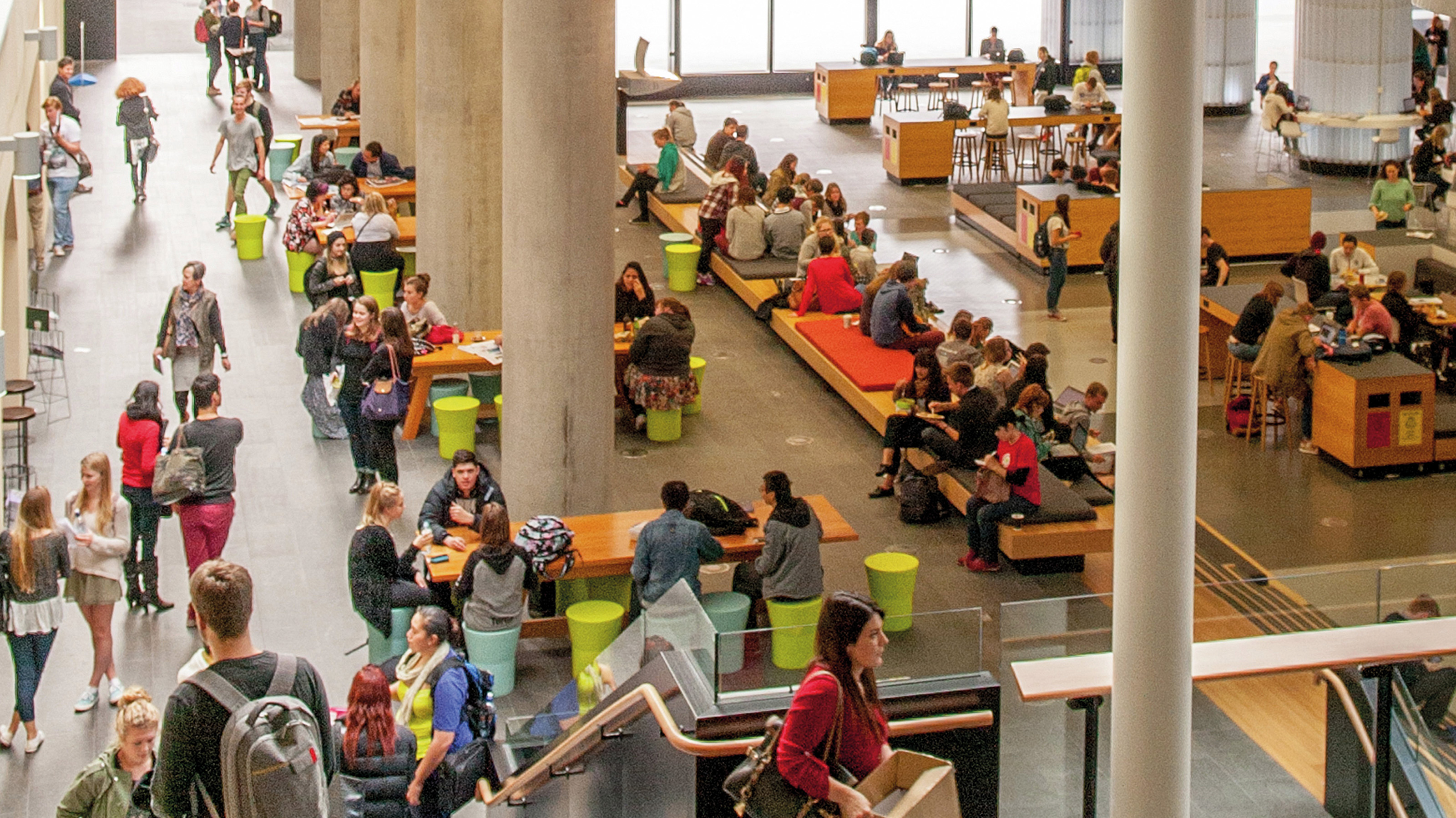 Students milling around in the Hub on Kelburn Campus