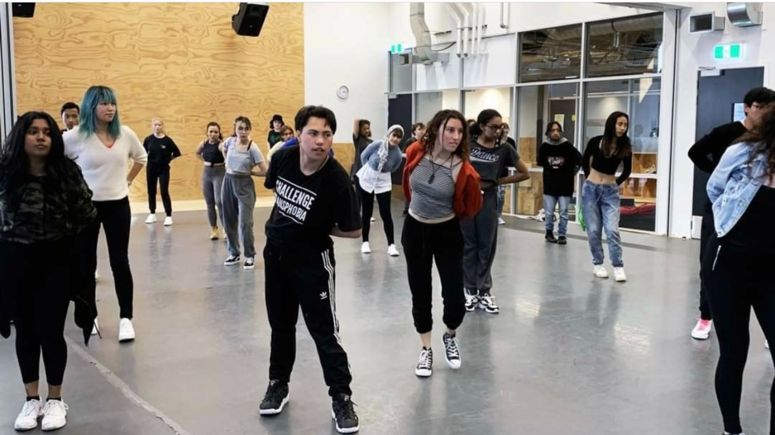 Students at dance practice indoors.