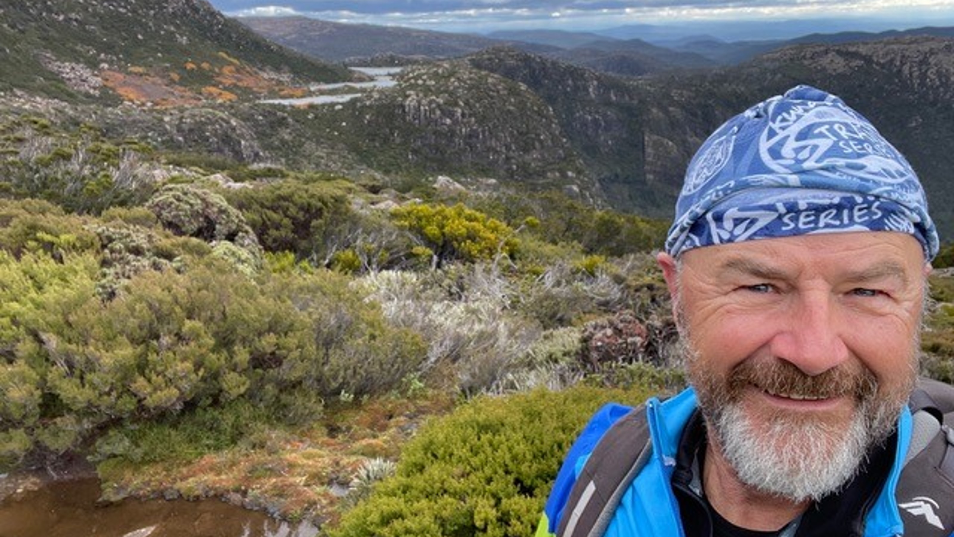 David Day posing with scenic background