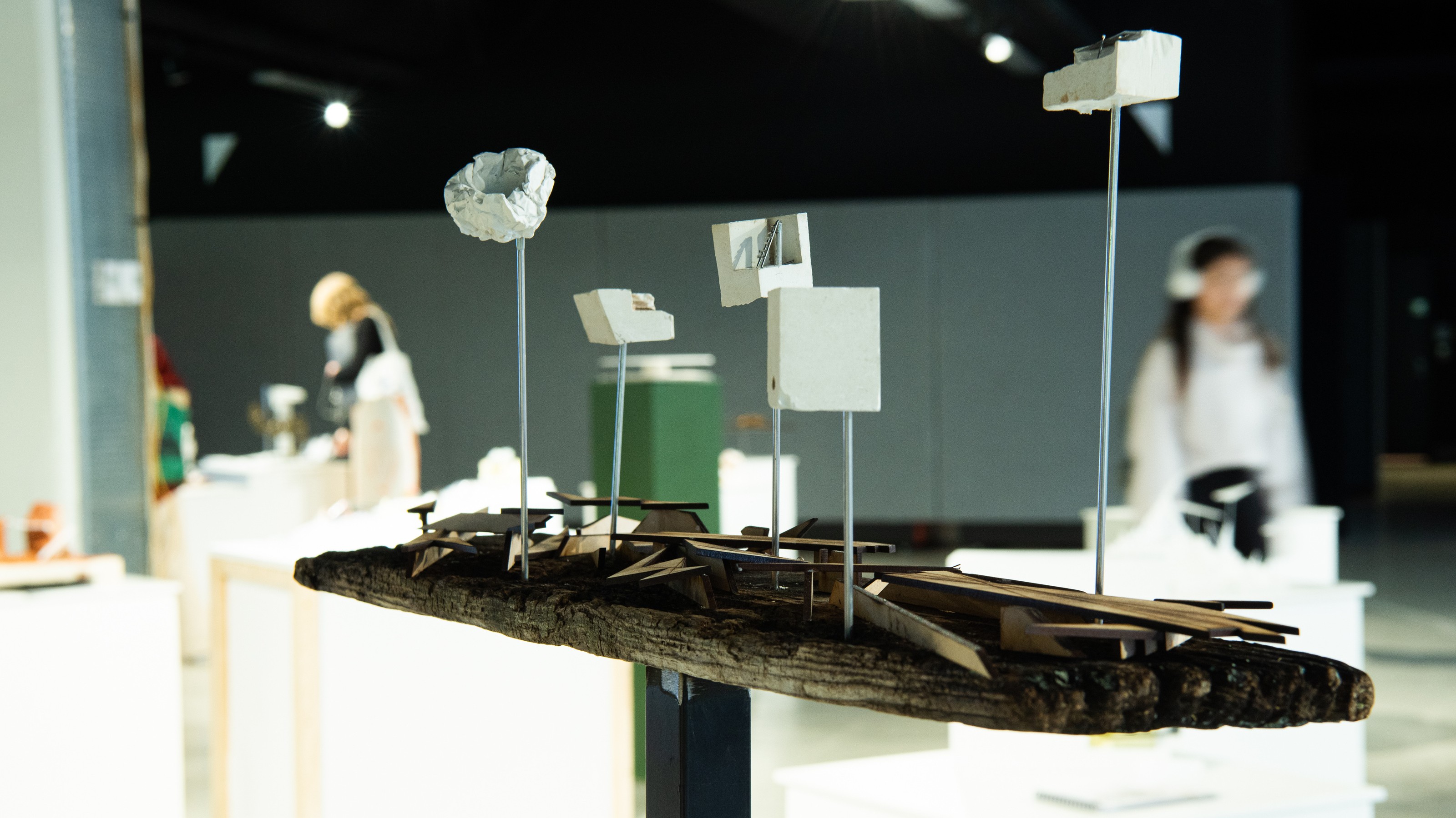 Wood and metal architectural model on display at Collective properties exhibition by SARC 261 elective students