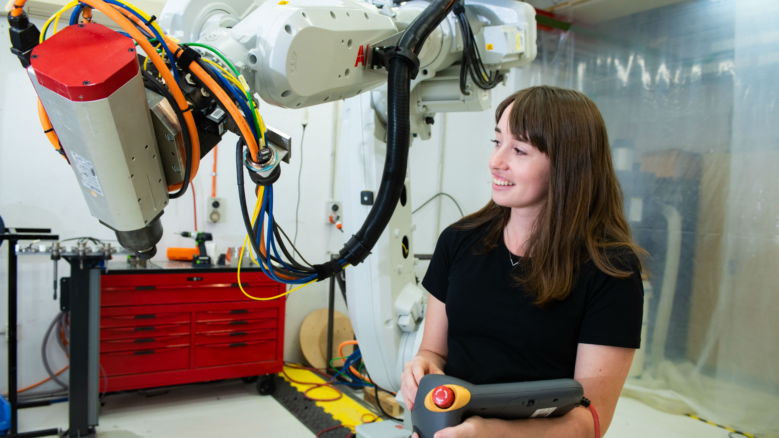 Student operates robotic arm