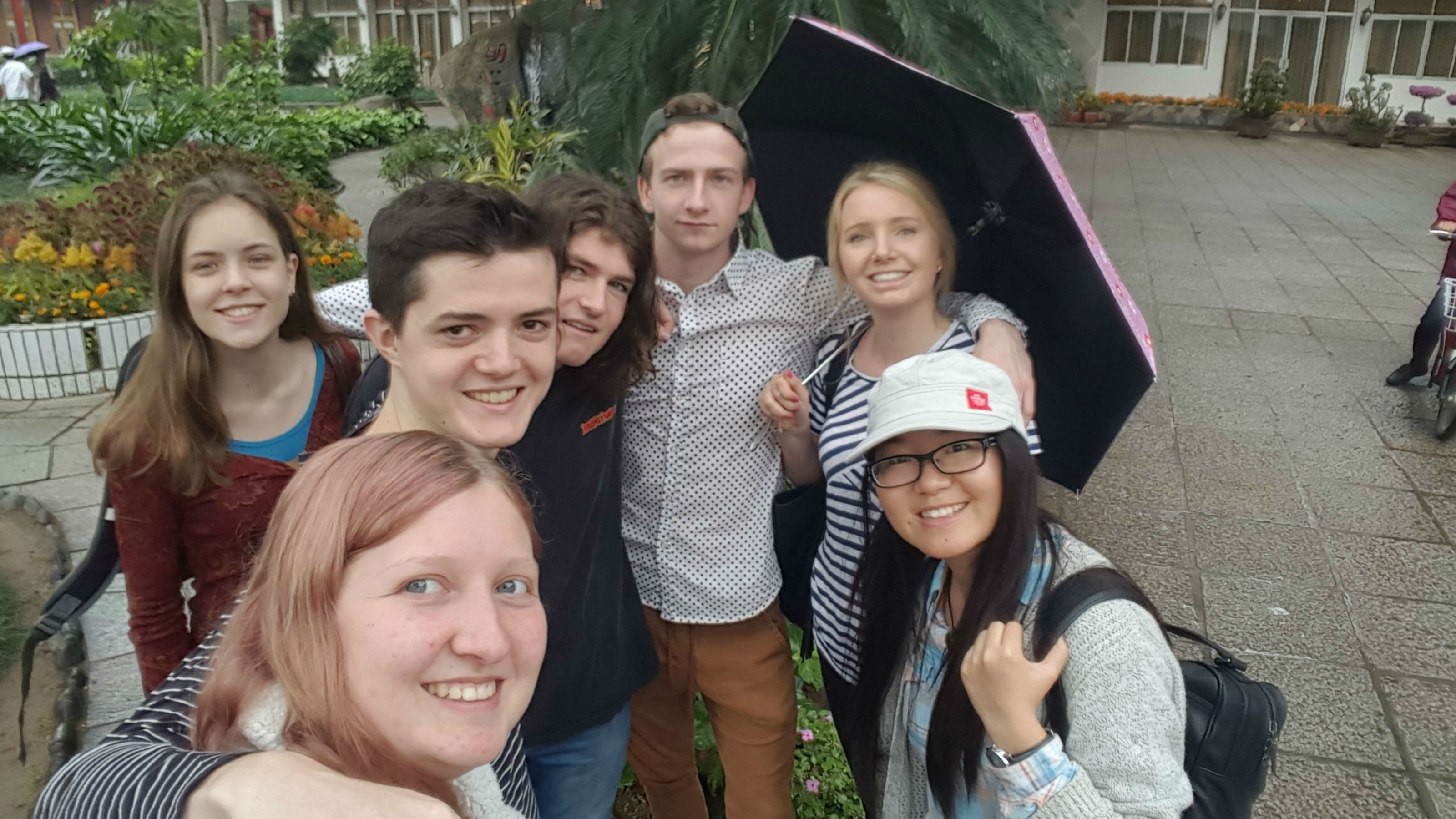Group selfie with seven young people smiling