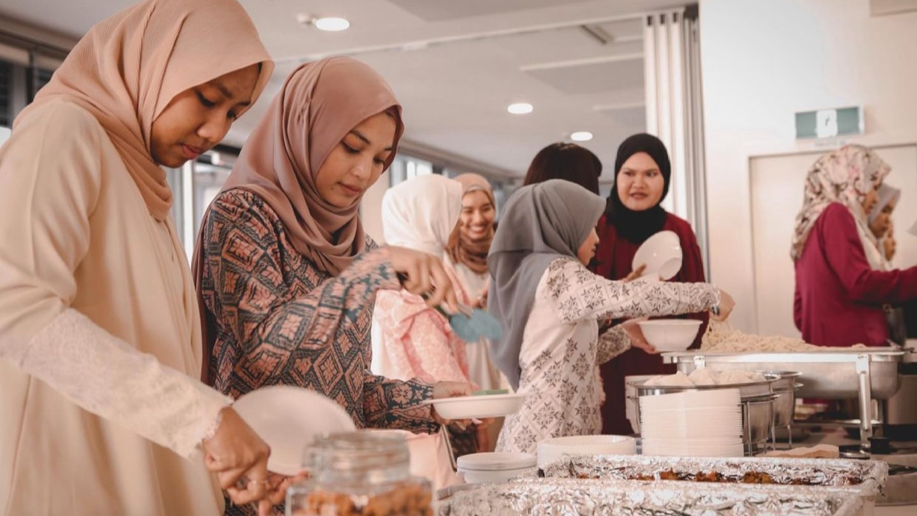 Students taking part in a group pot luck.