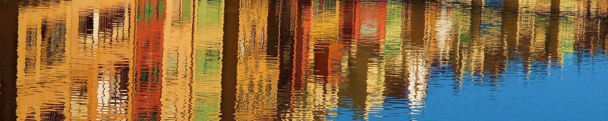 A reflection of buildings in the water.