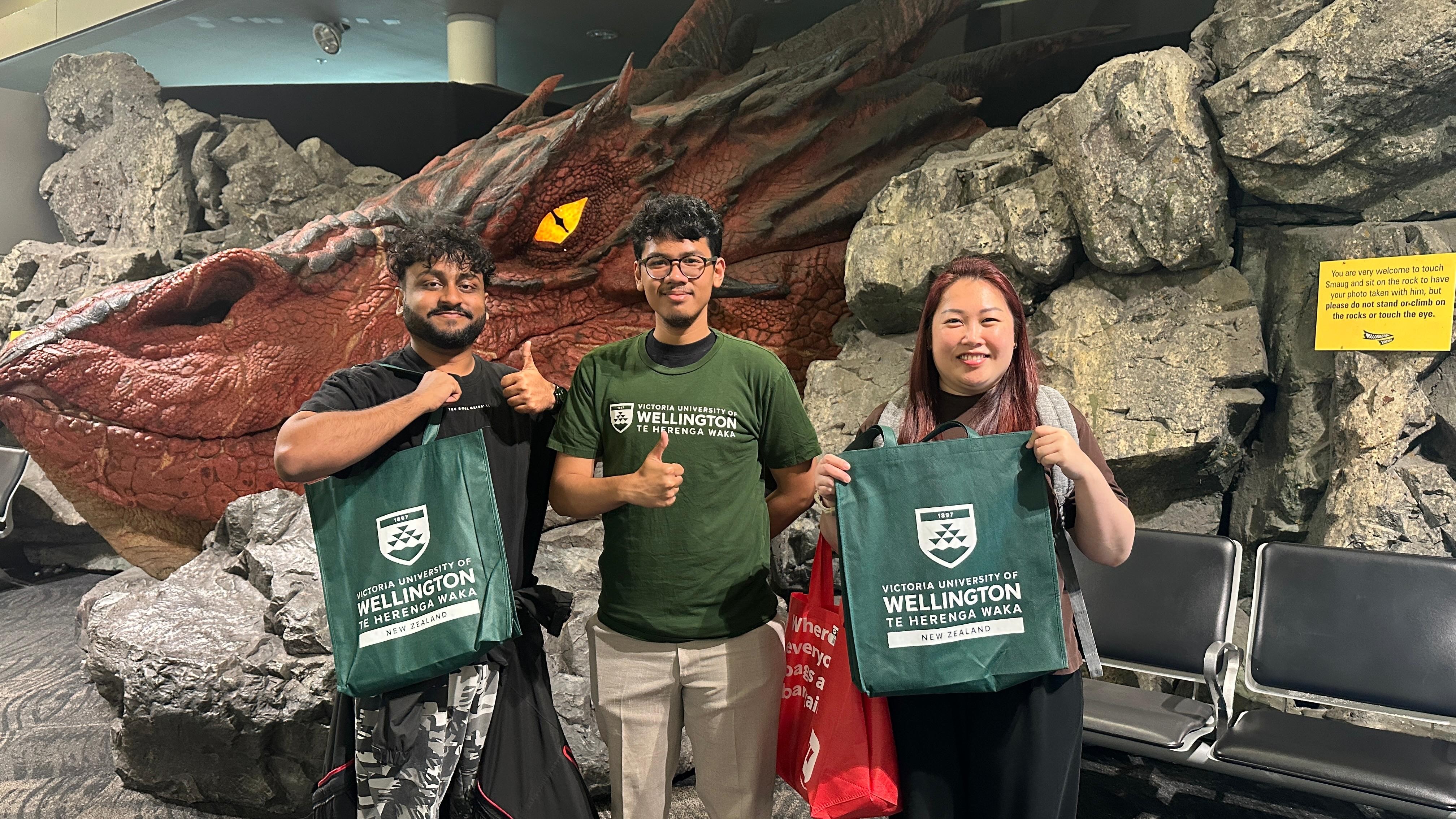 Uni crews holding welcome bags at Wellington airport
