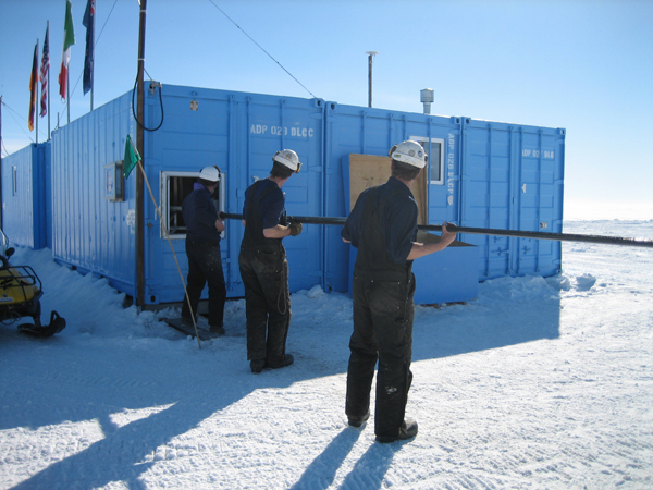 Moving length of core into the drill hut c. Tamsin Falconer 2006-2007