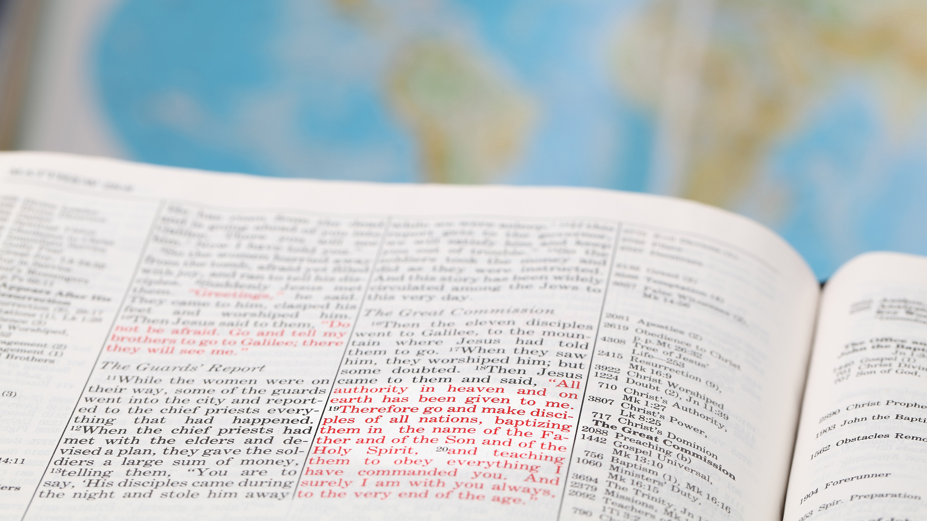 An open book with red text in two passages