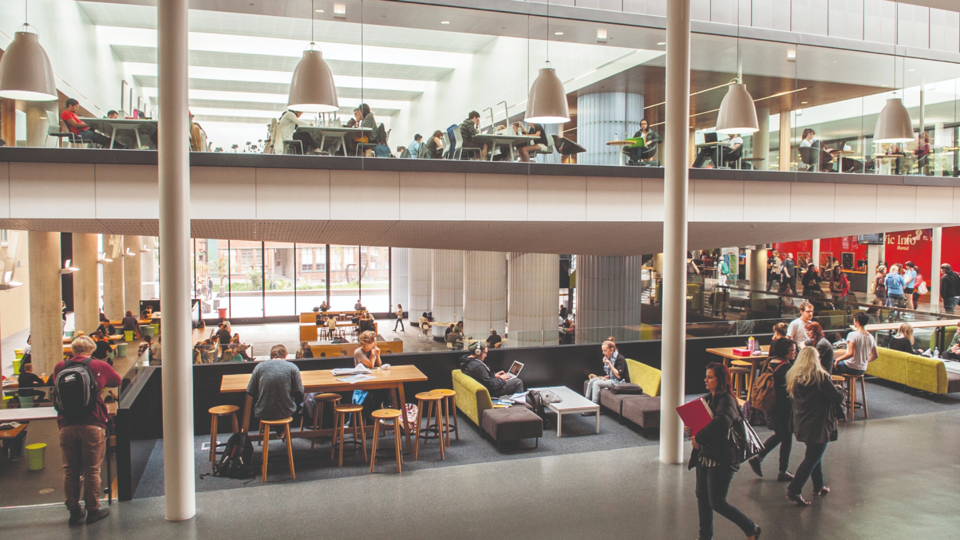 Students sitting and walking around the Hub, Kelburn campus.