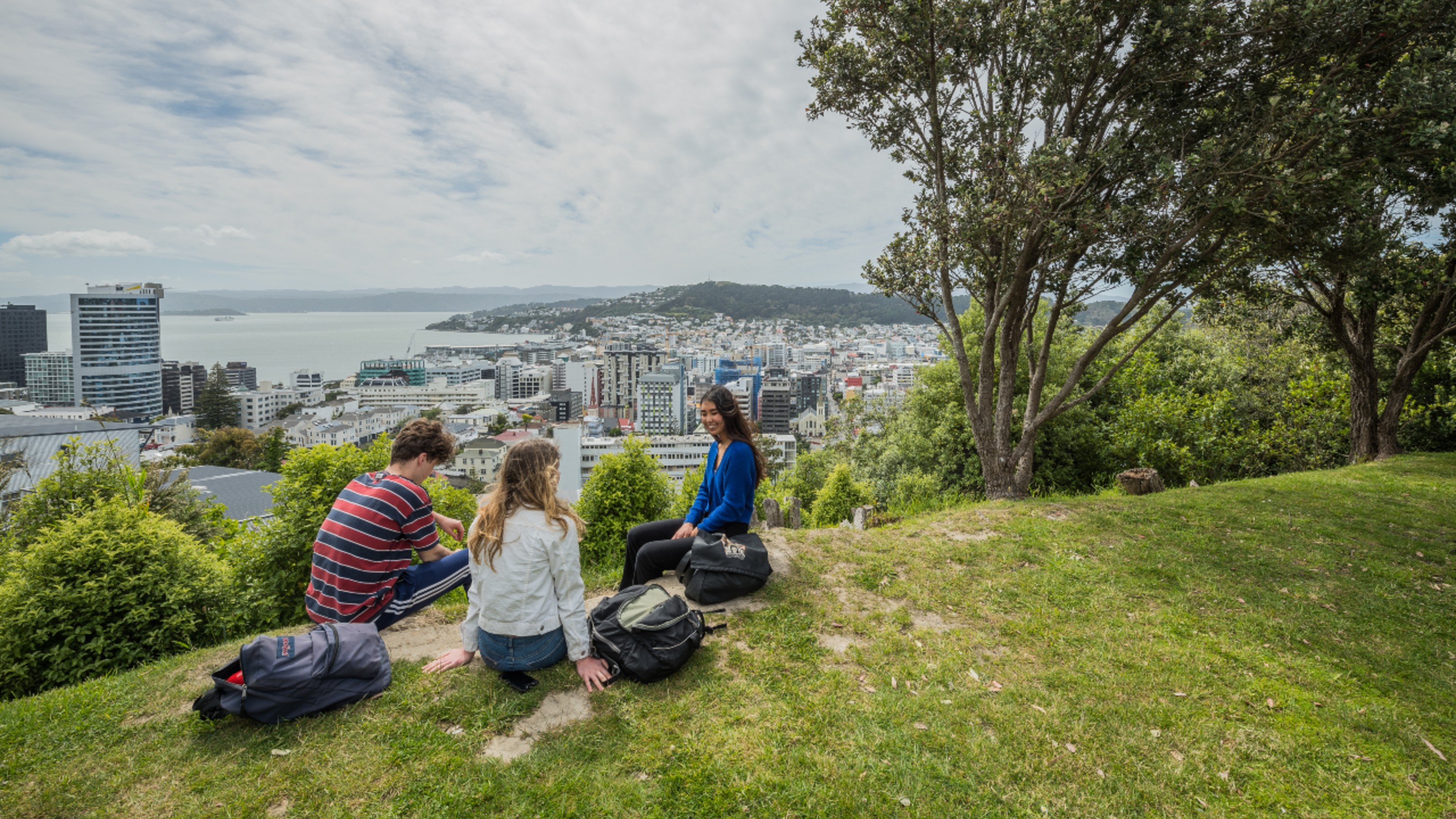 A group of students sitting in a Wellington park