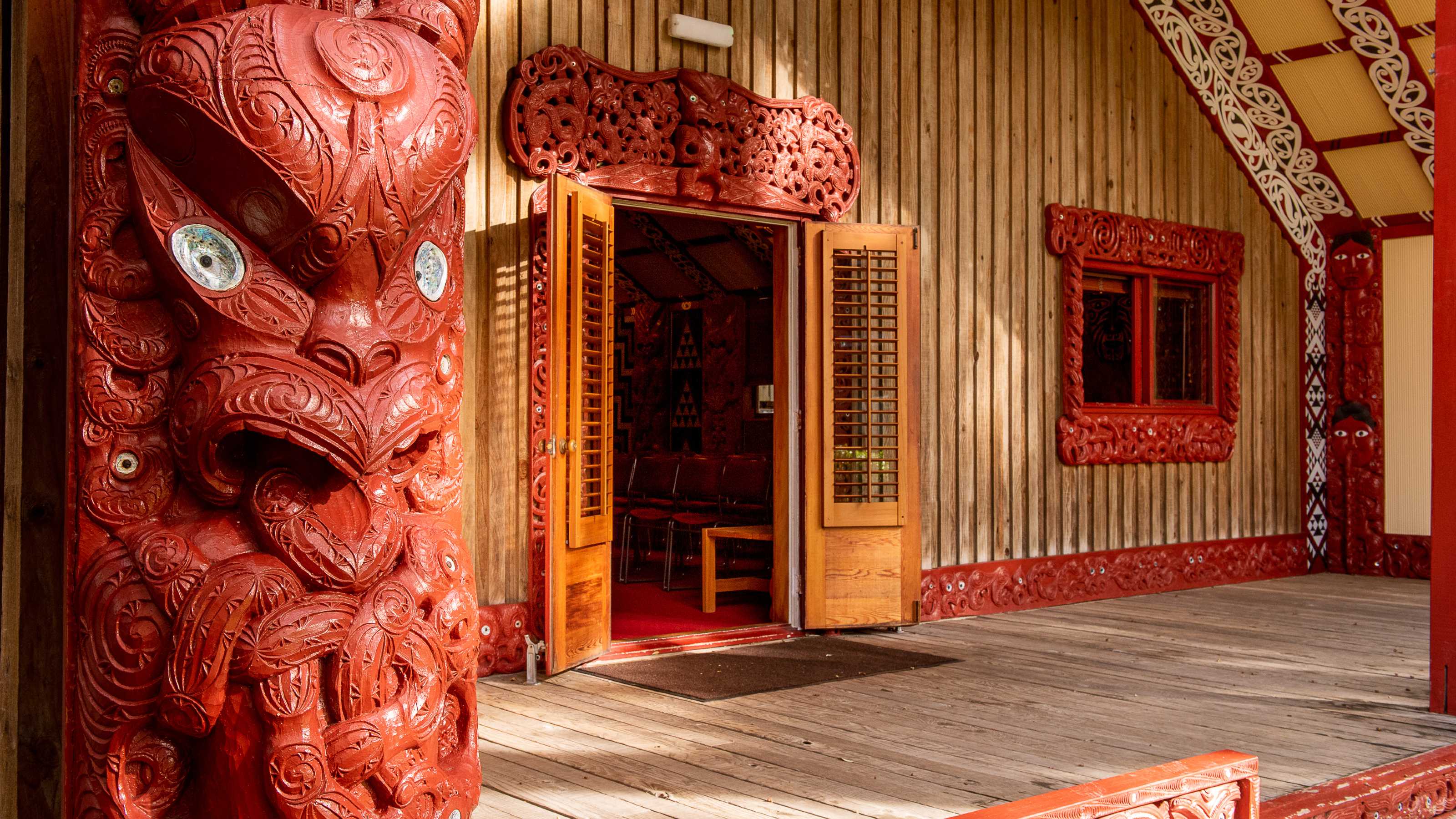 Close up details of the front of the carved house