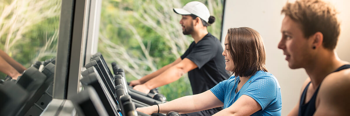A trio pump up their endorphins on elliptical trainers.