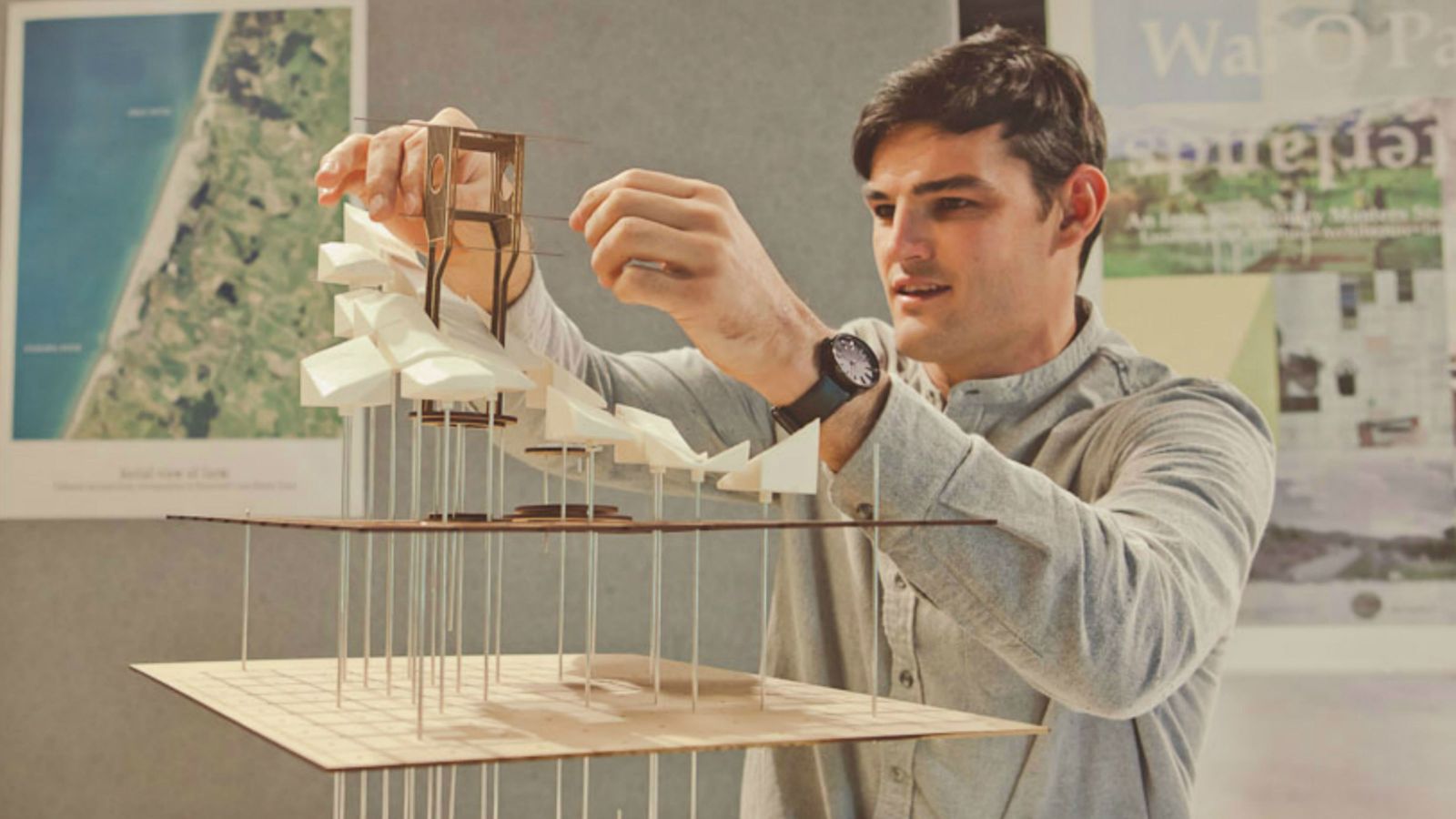 Student Devon Booth assembling a model for his fourth year architecture studies.