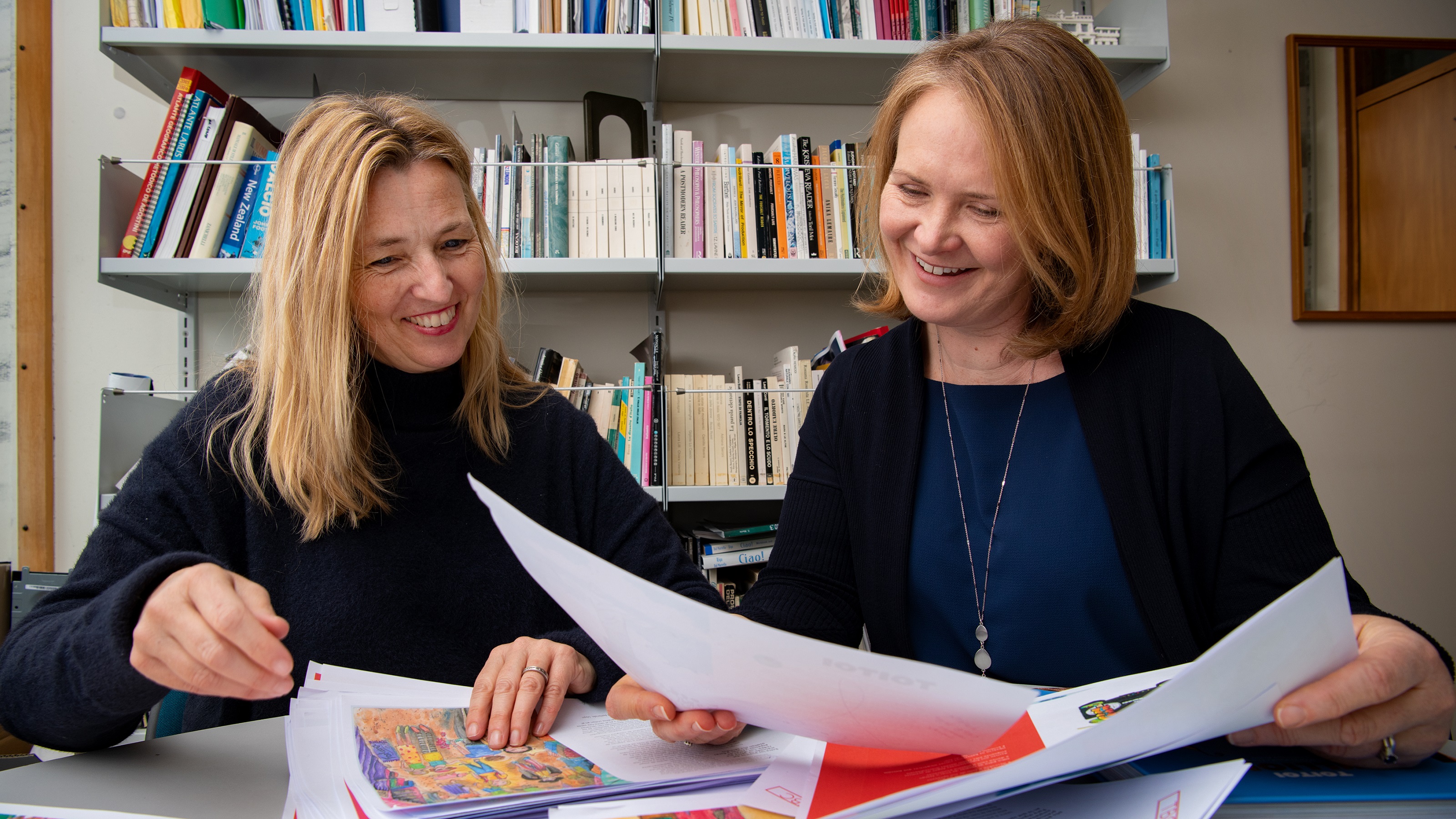 Sally and Charlotte looking over Toitoi print proofs