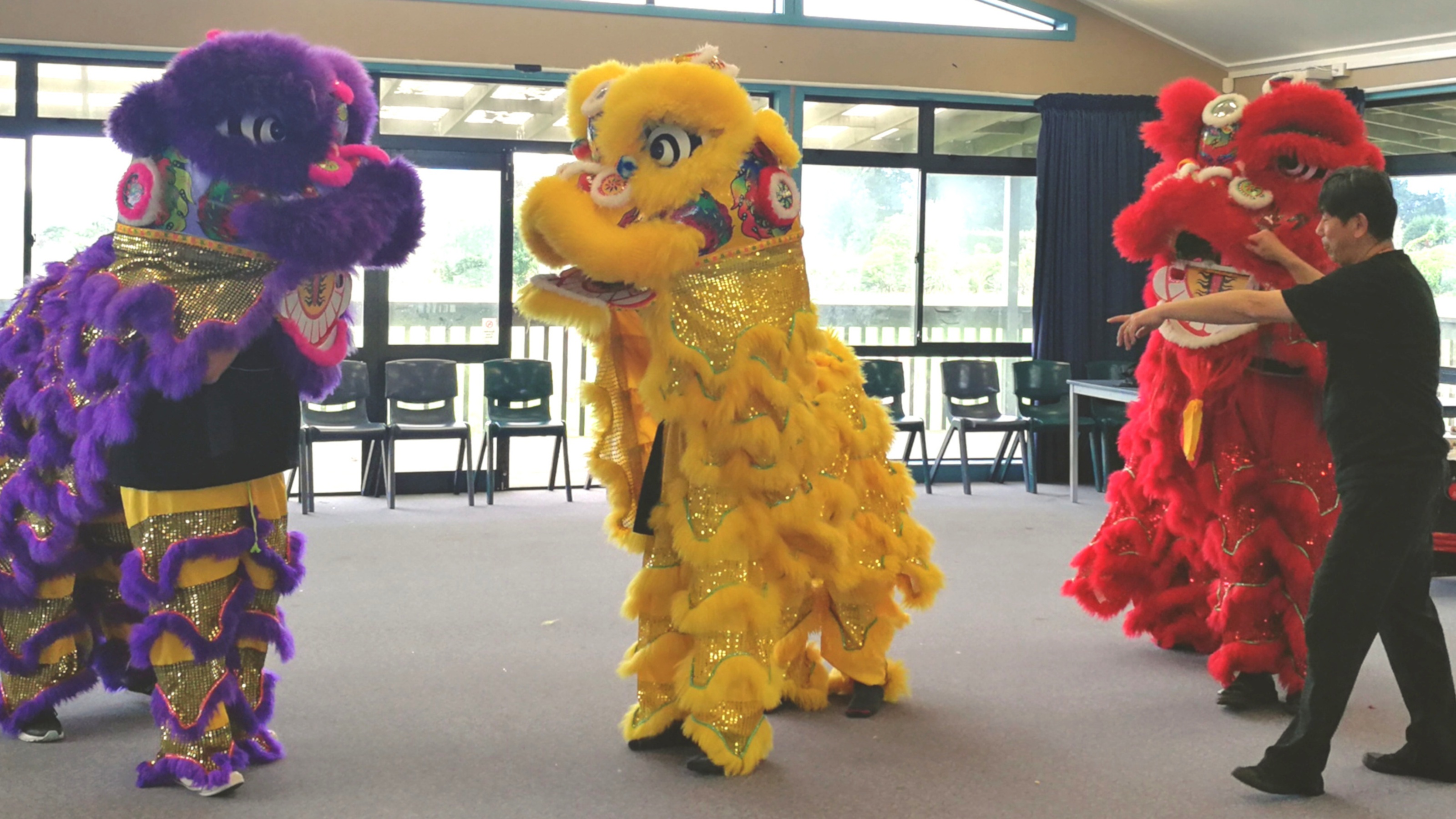 Students participate in a lion dance workshop.