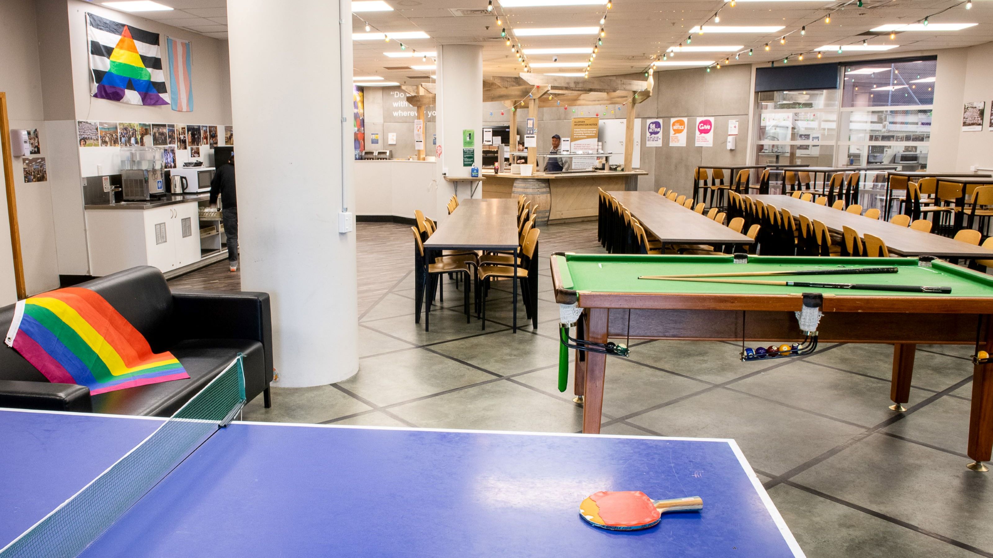 Pool and table tennis in a common space at Joan Stevens Hall.