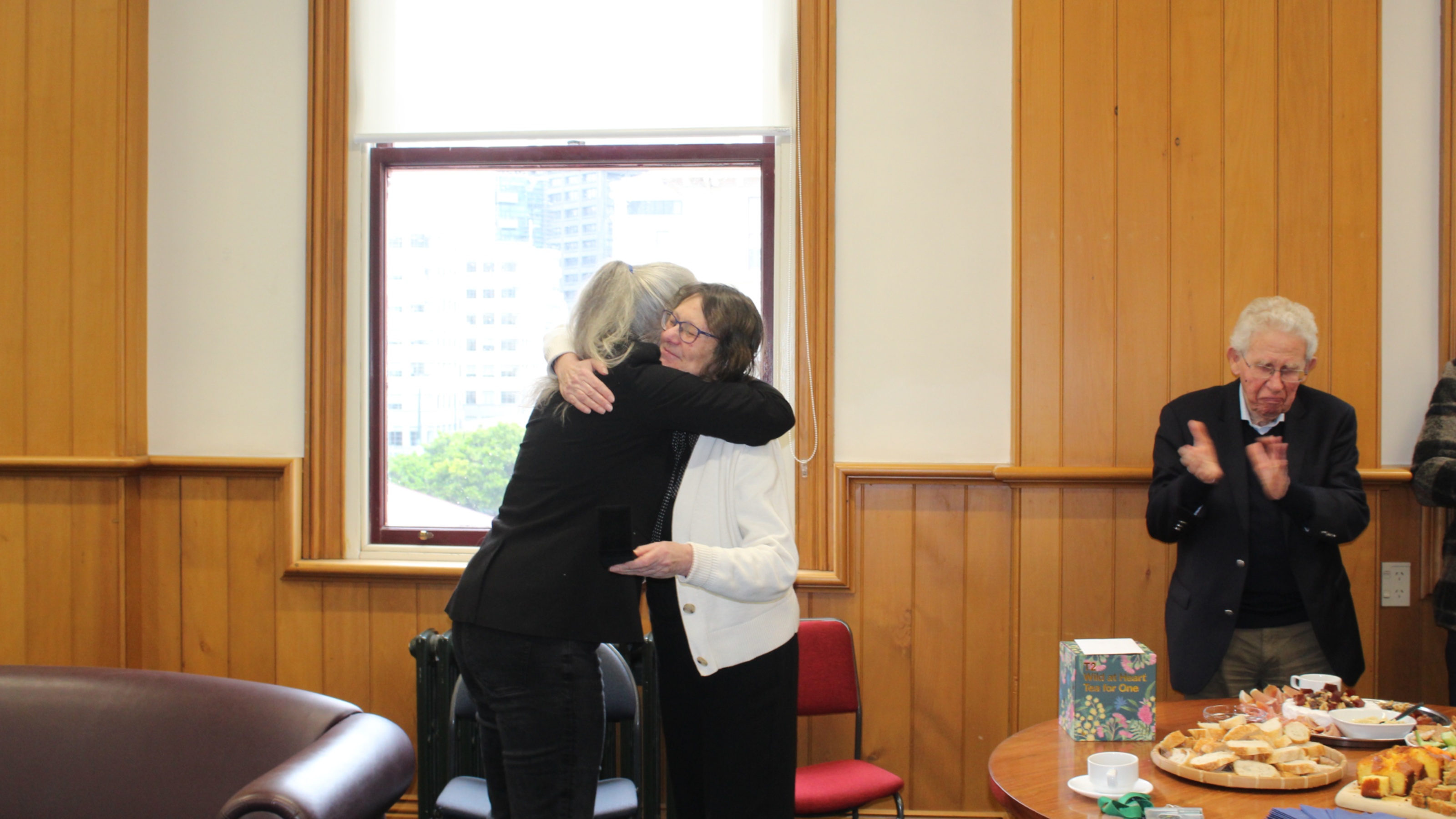 two women hug