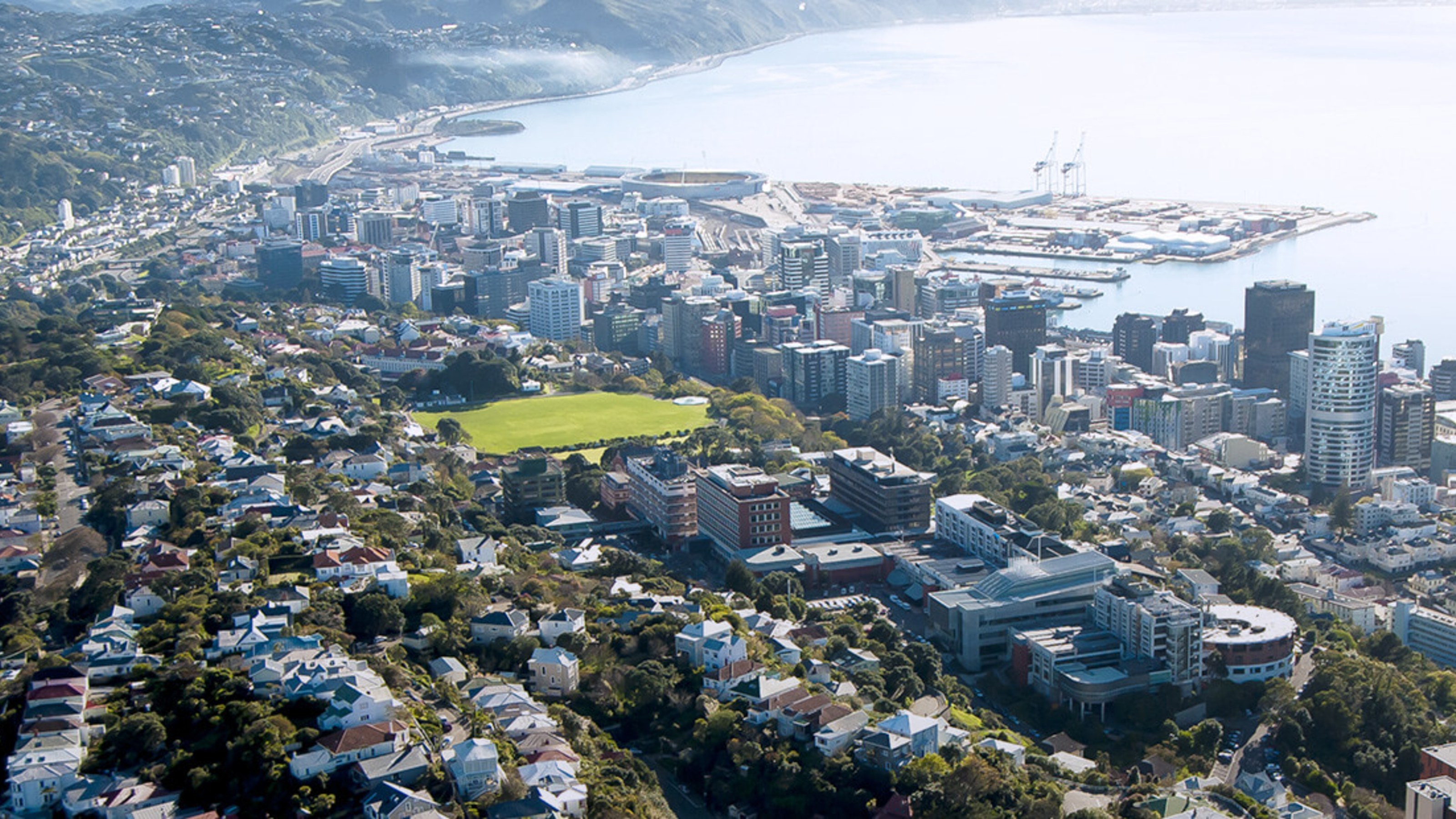 Aerial view of Wellington with Kelburn campus in foreground and harbour in background