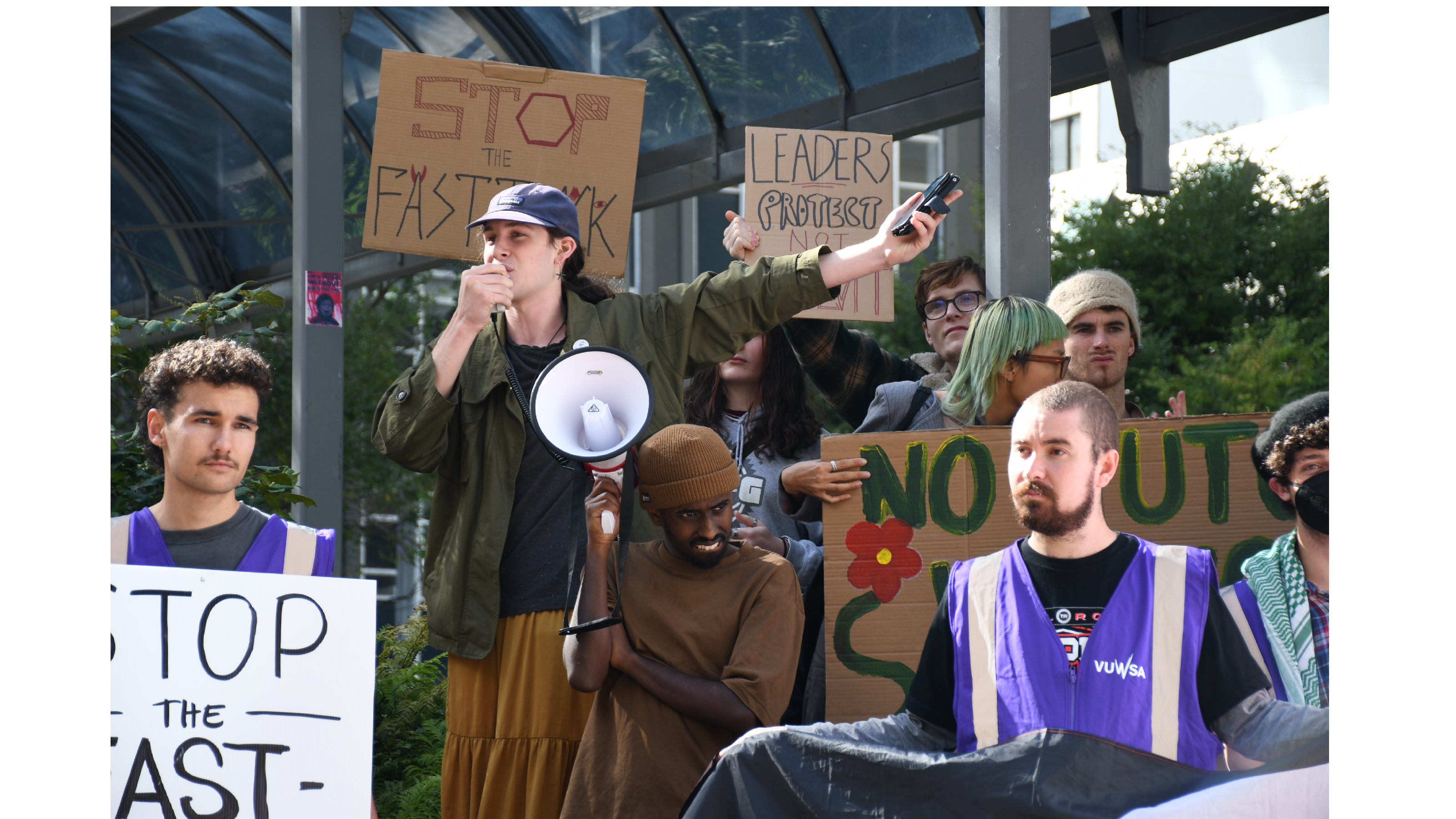A woman with a megaphone protesting the fast-track bill.