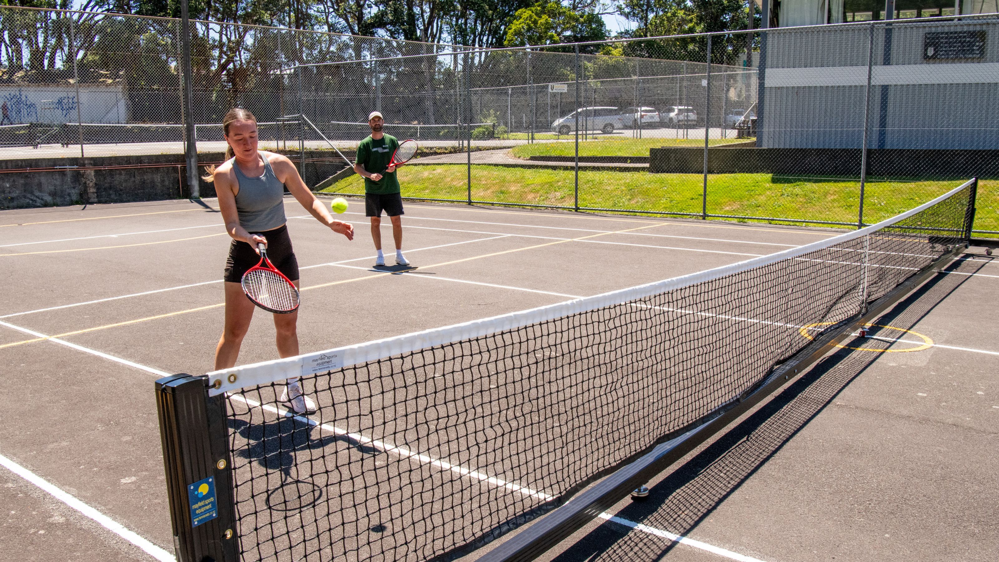 Two tennis players on a sunny day