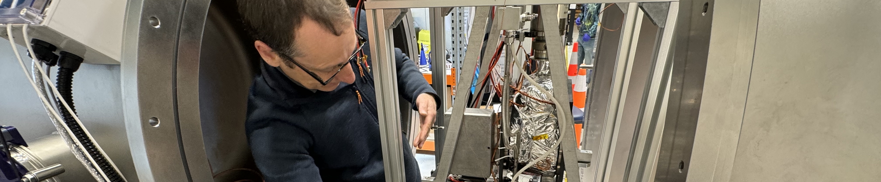 Facilities and Emile working on vacuum chamber