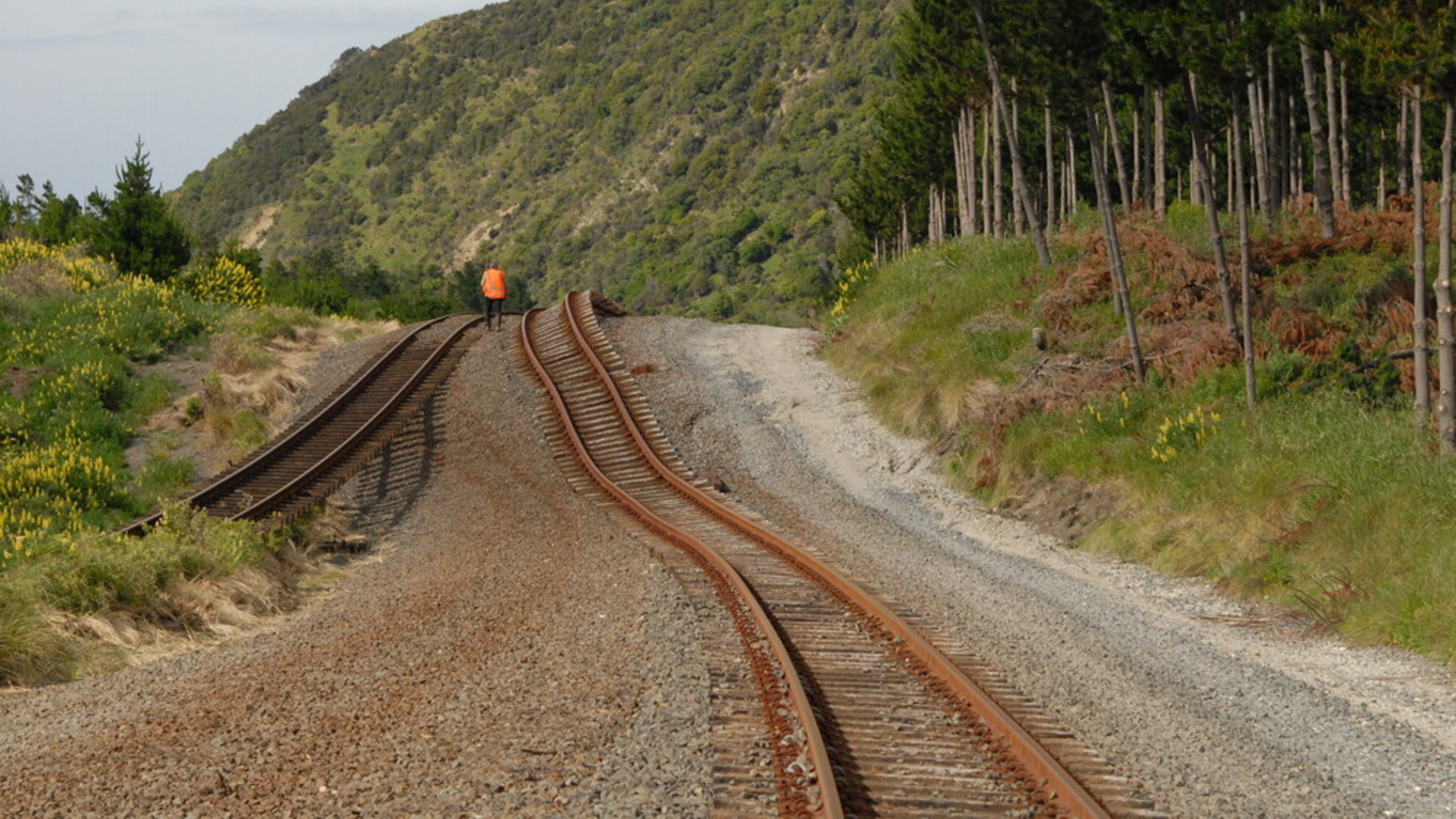 A photo showing the aftermath of an earthquake, with bent train tracks.