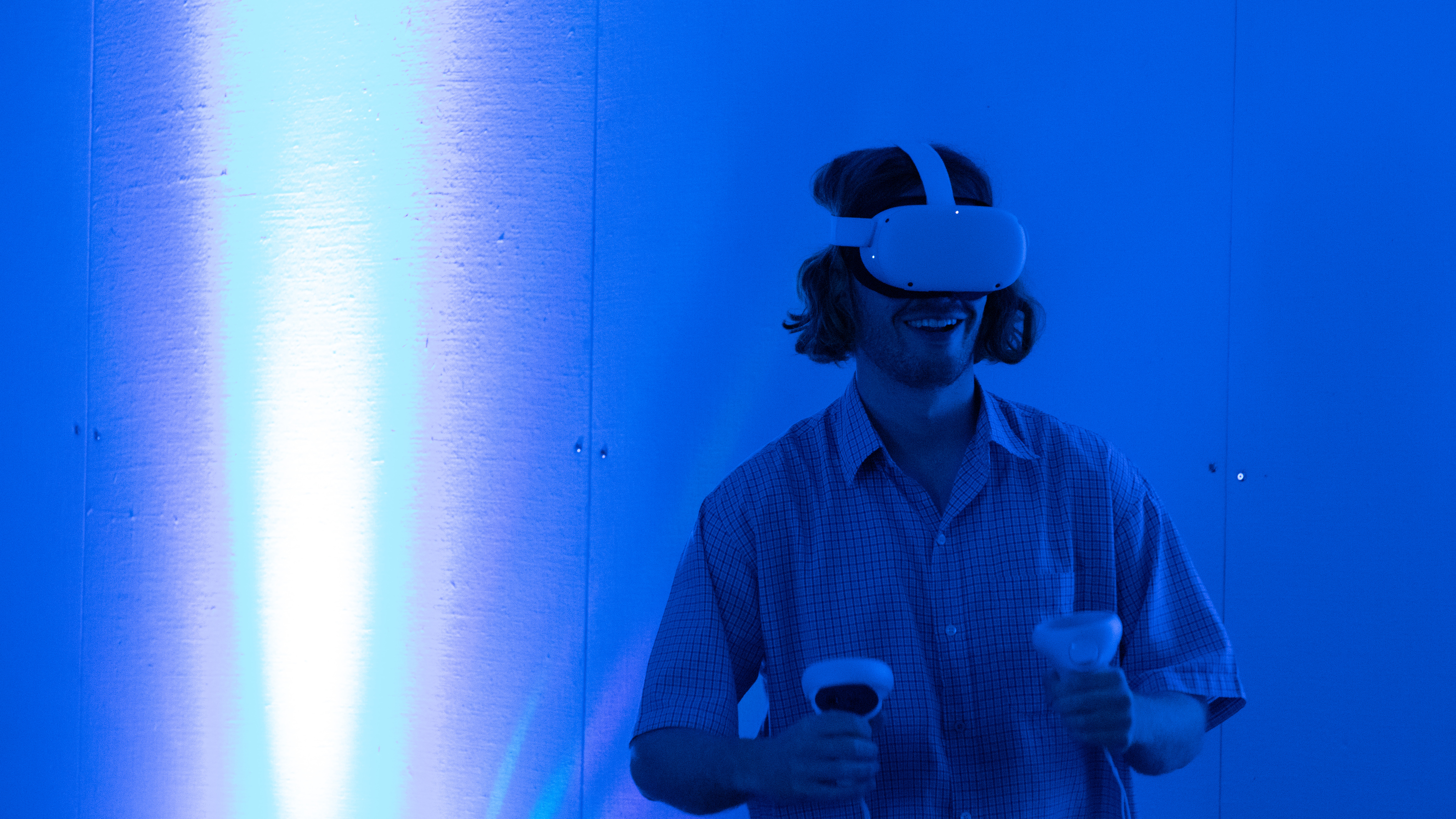 Blue light with person wearing a VR headset